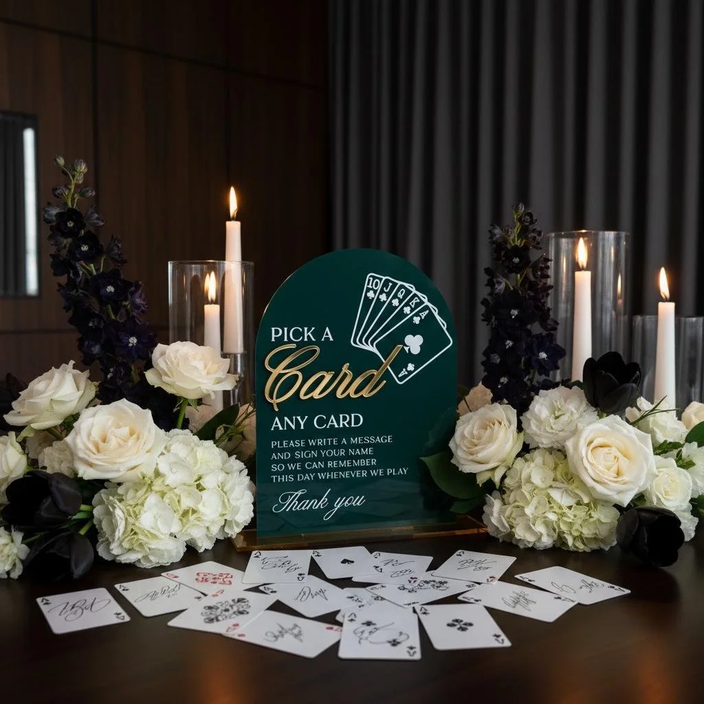 Emerald green acrylic Pick a Card and Leave a Note wedding guestbook sign with playing cards and flowers
