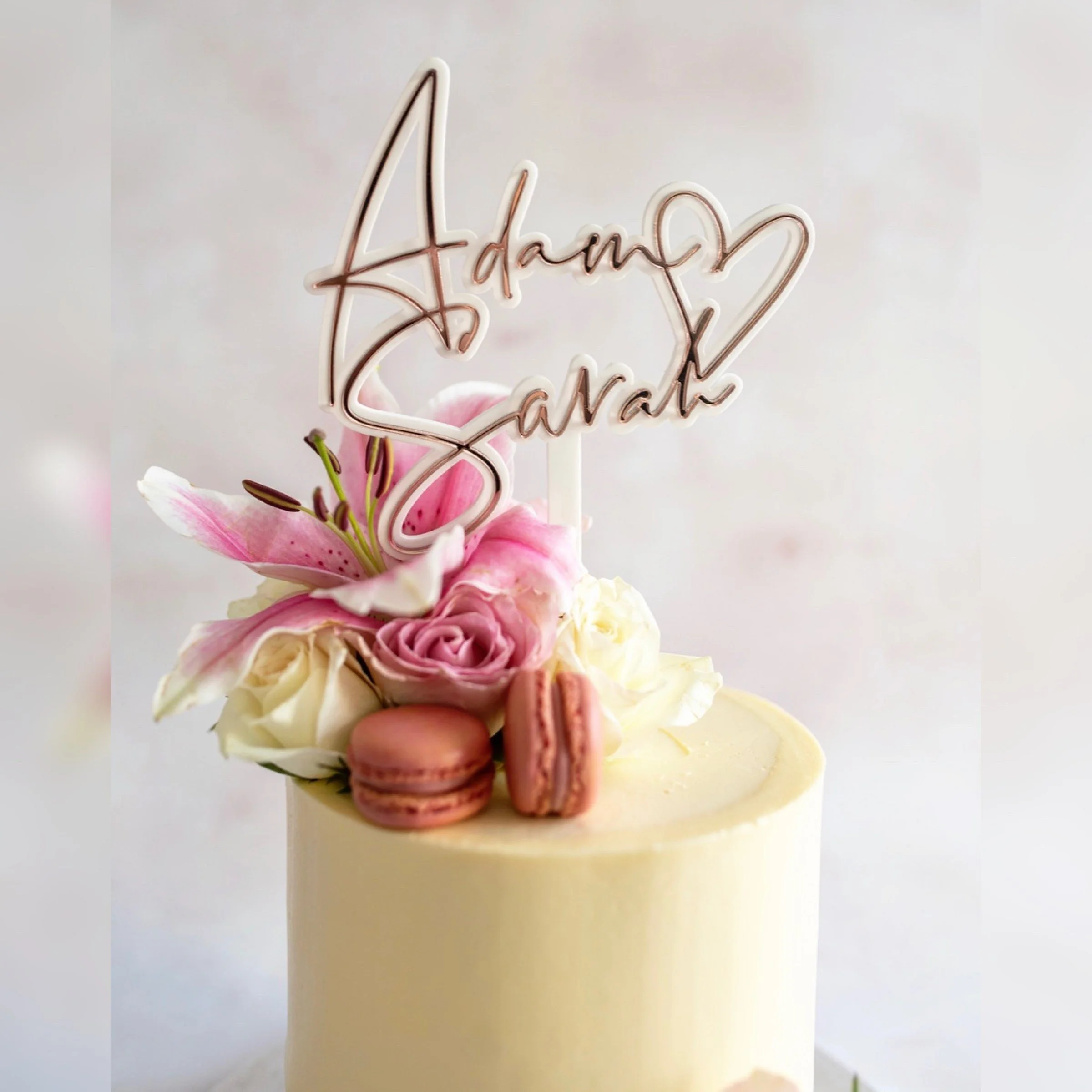 Personalised Adam and Sarah acrylic heart cake topper with rose-gold detailing
