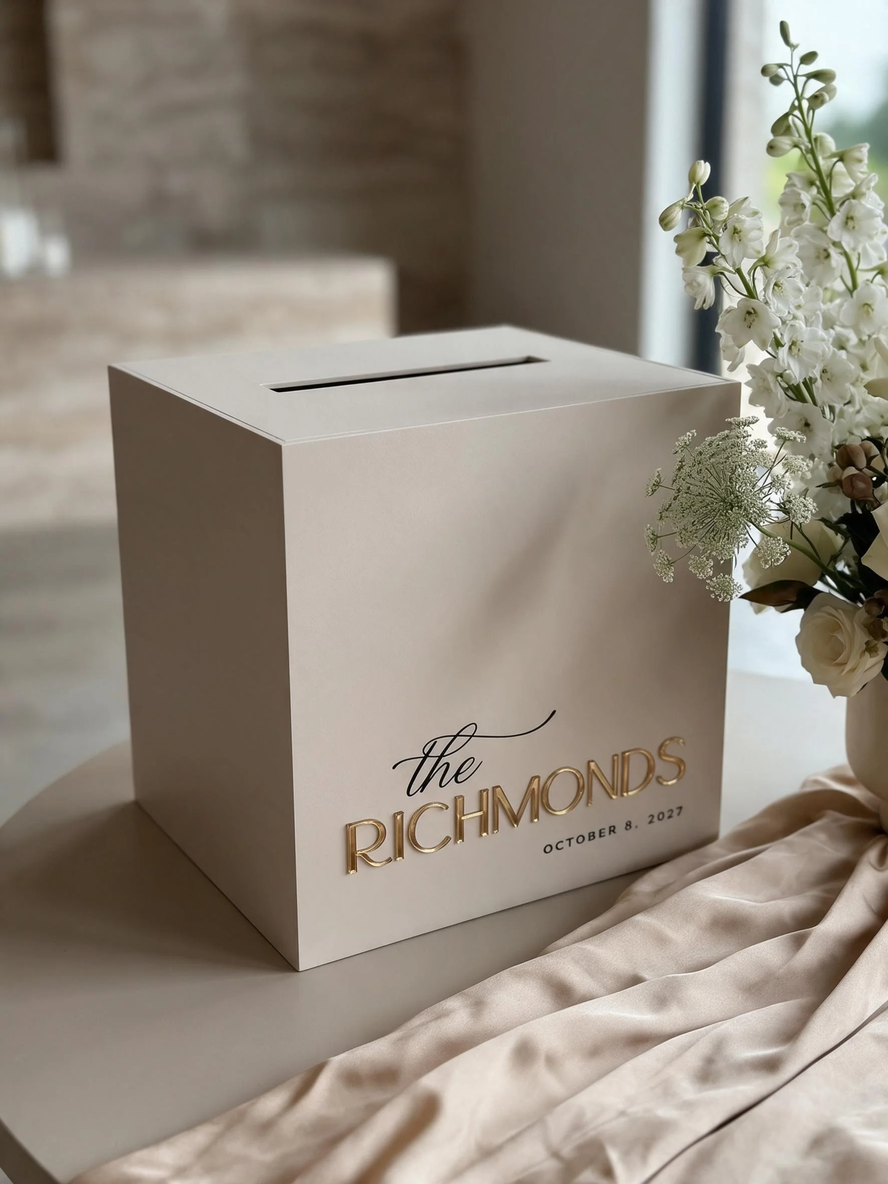 Personalised white acrylic wedding post box with raised gold surname and printed wedding date