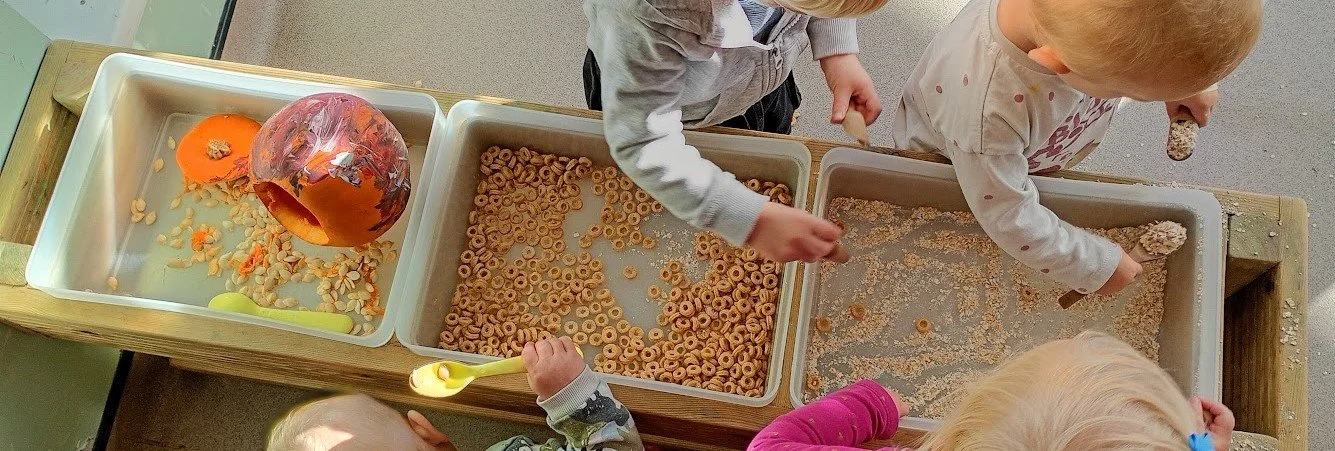 Children exploring sensory play together at Rydal Day Nursery