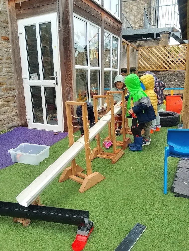 Pre-School children enjoying outdoor water play at Rydal Day Nursery