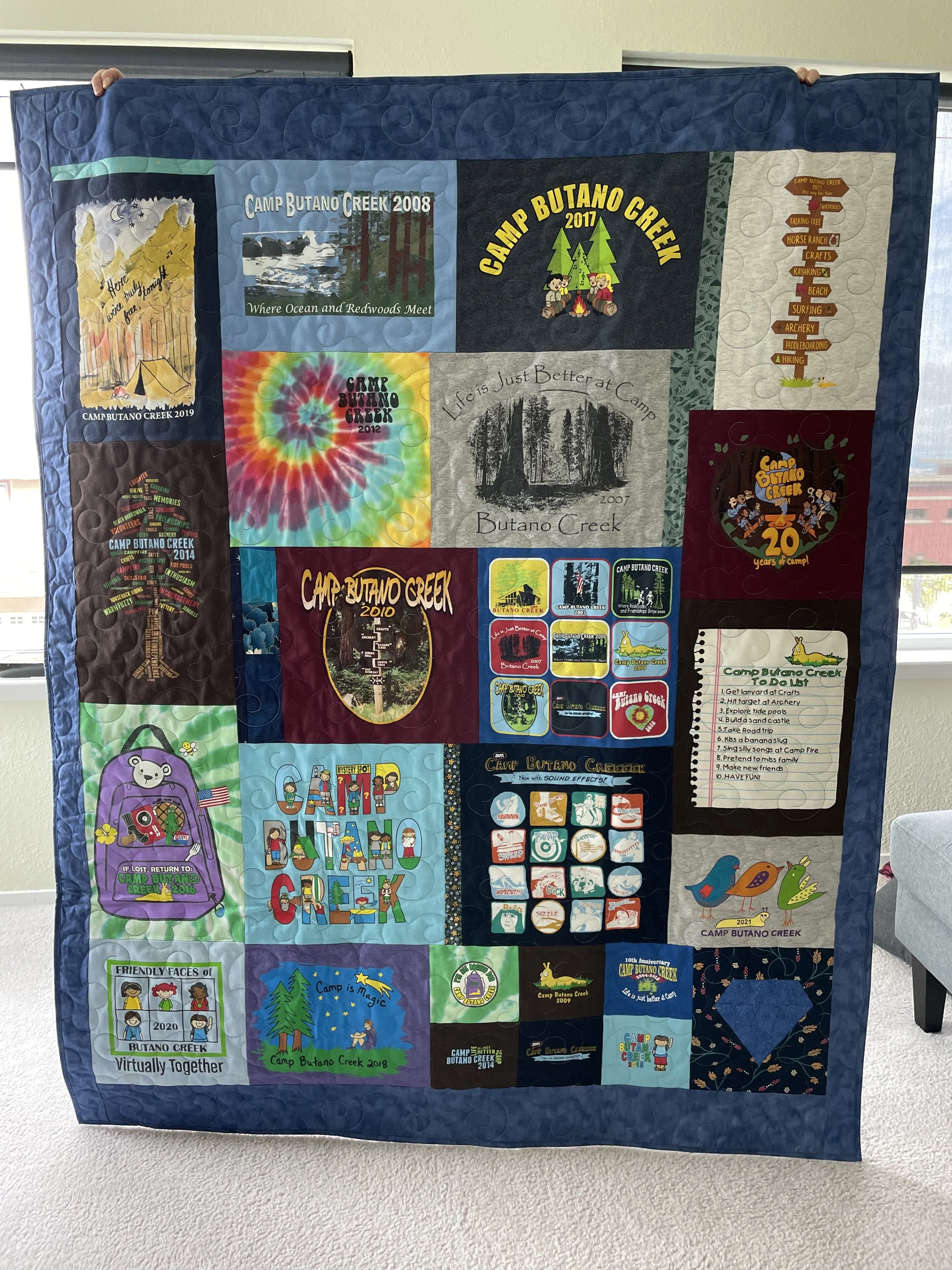 quilt made from a patchwork of tee shirts