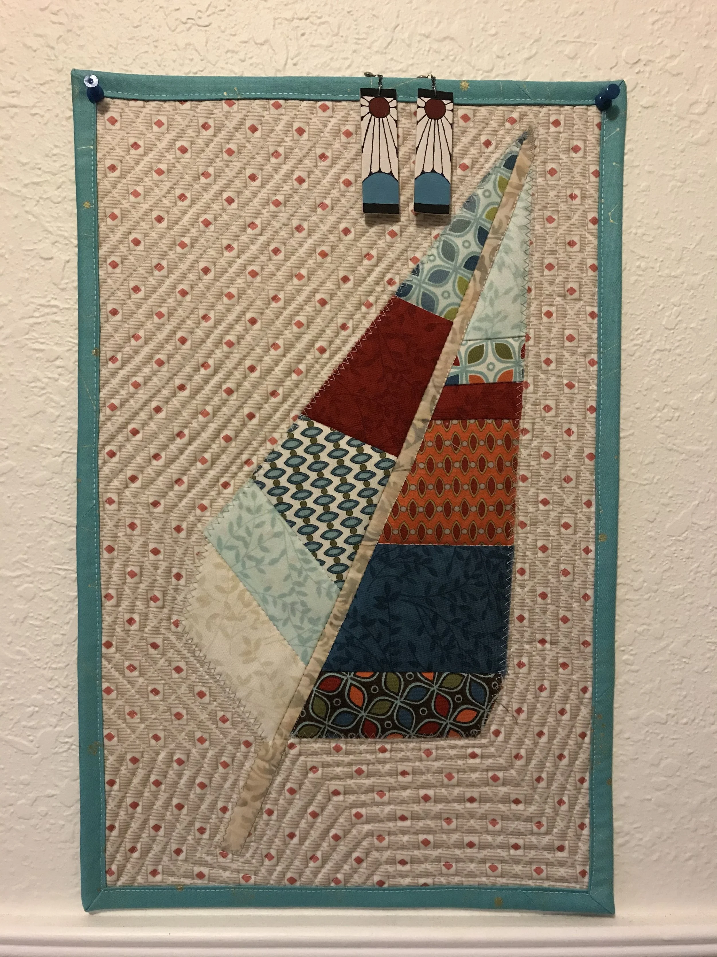 quilted feather pattern with handmade earrings