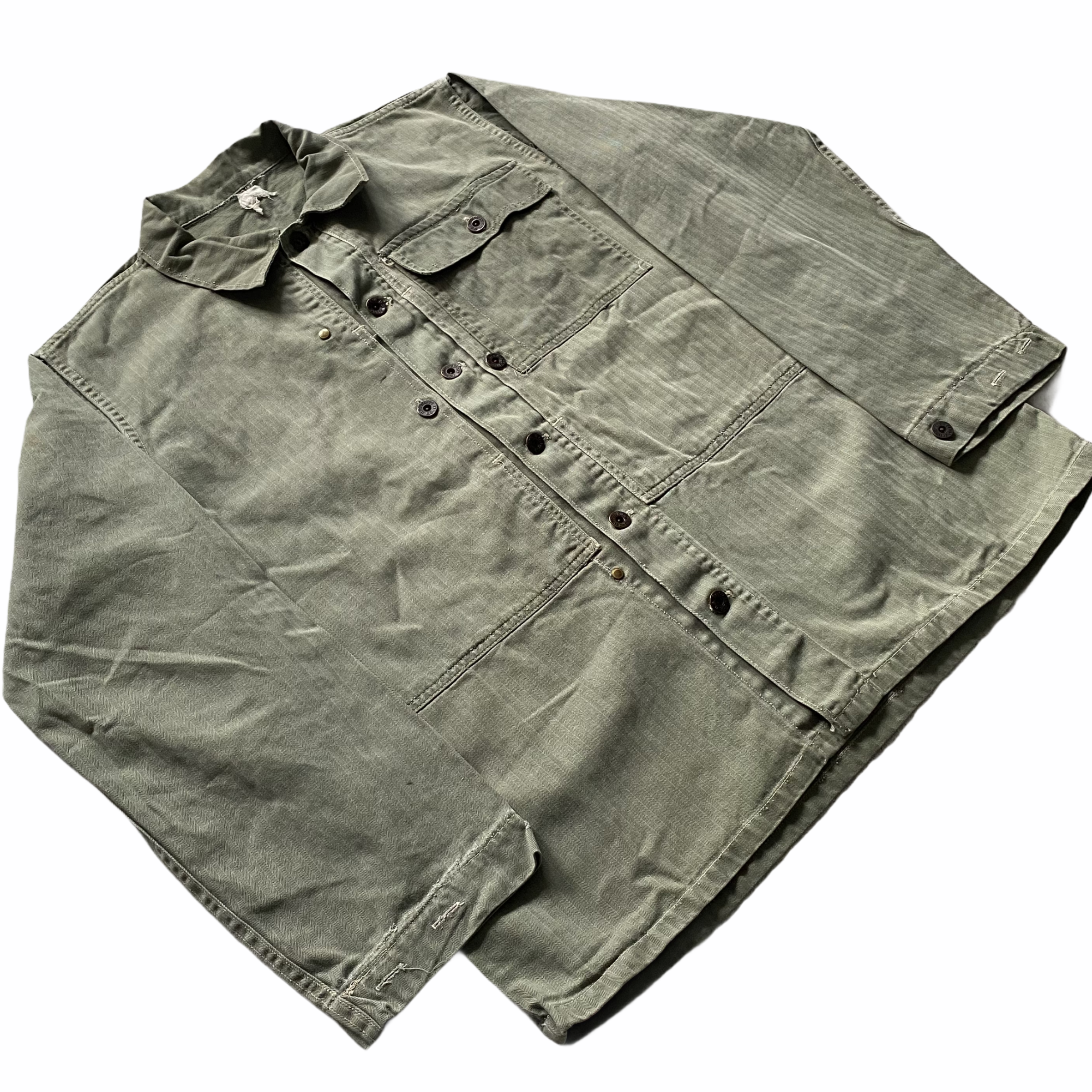 A folded, light olive green, long-sleeve button-up shirt with chest pockets placed on a plain white background.