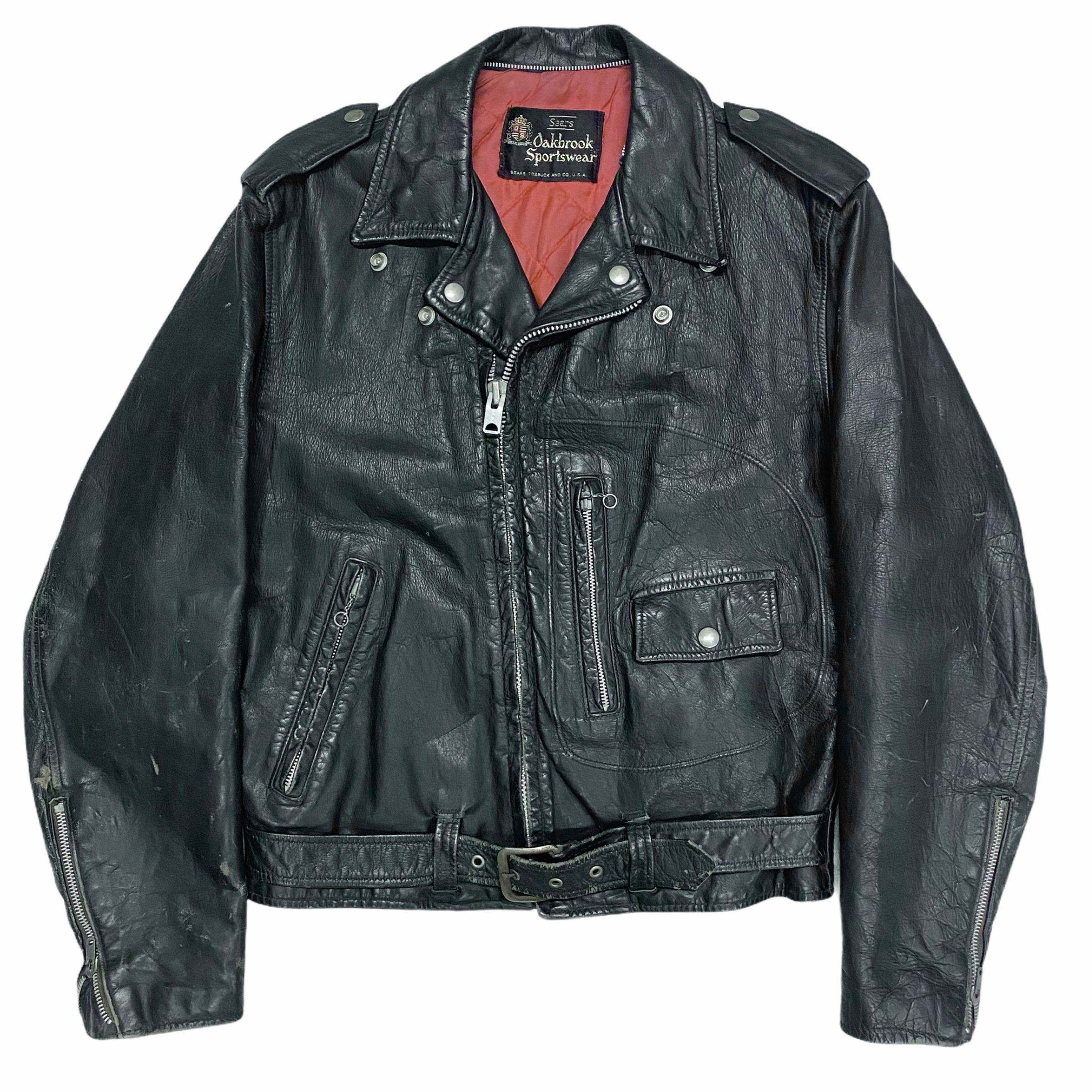 Black leather motorcycle jacket with zipper details and shoulder epaulets, open to reveal a red lining and a label from Oakbrook Sportswear inside.