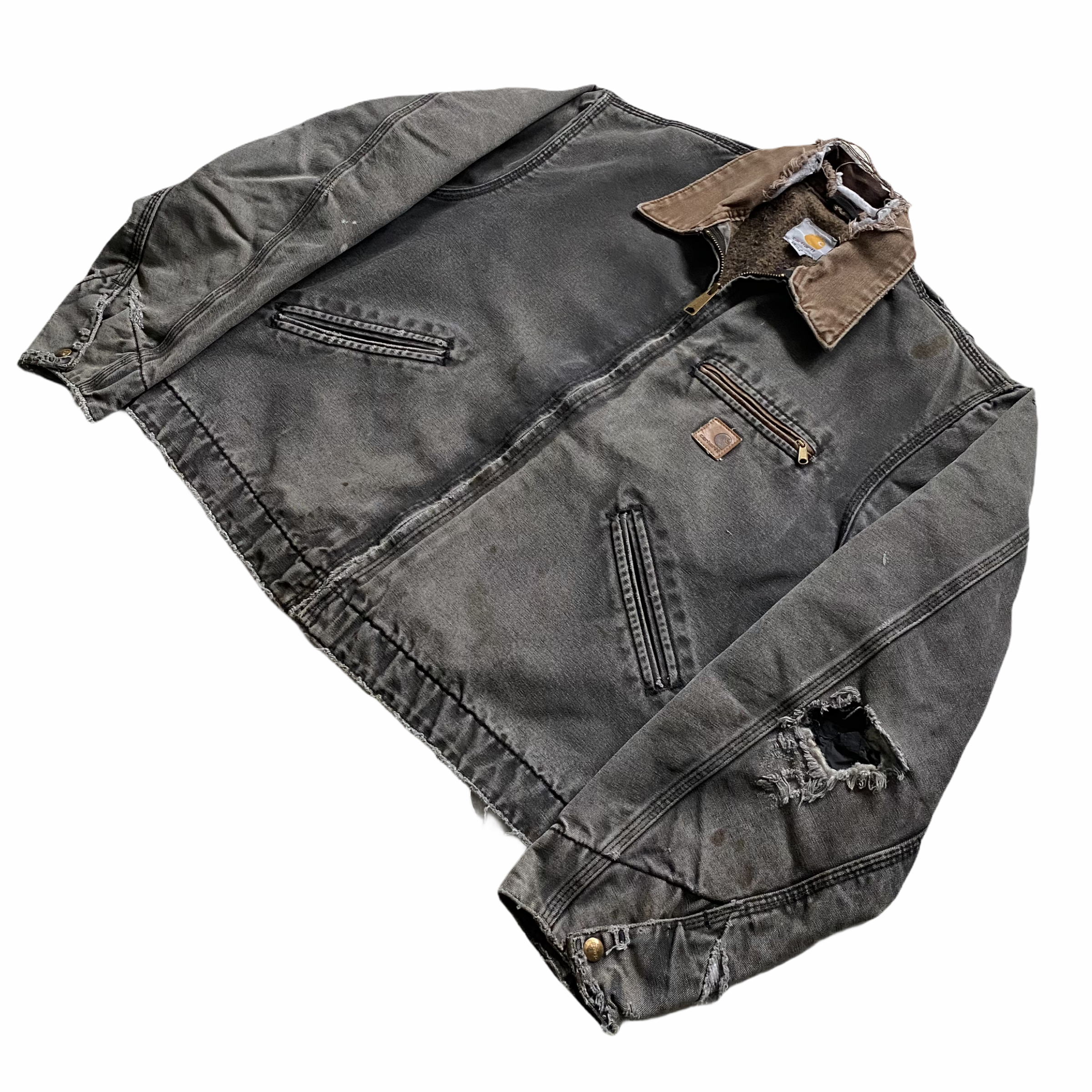 A black denim jacket with brown collar and distressed details, lying on a white background.