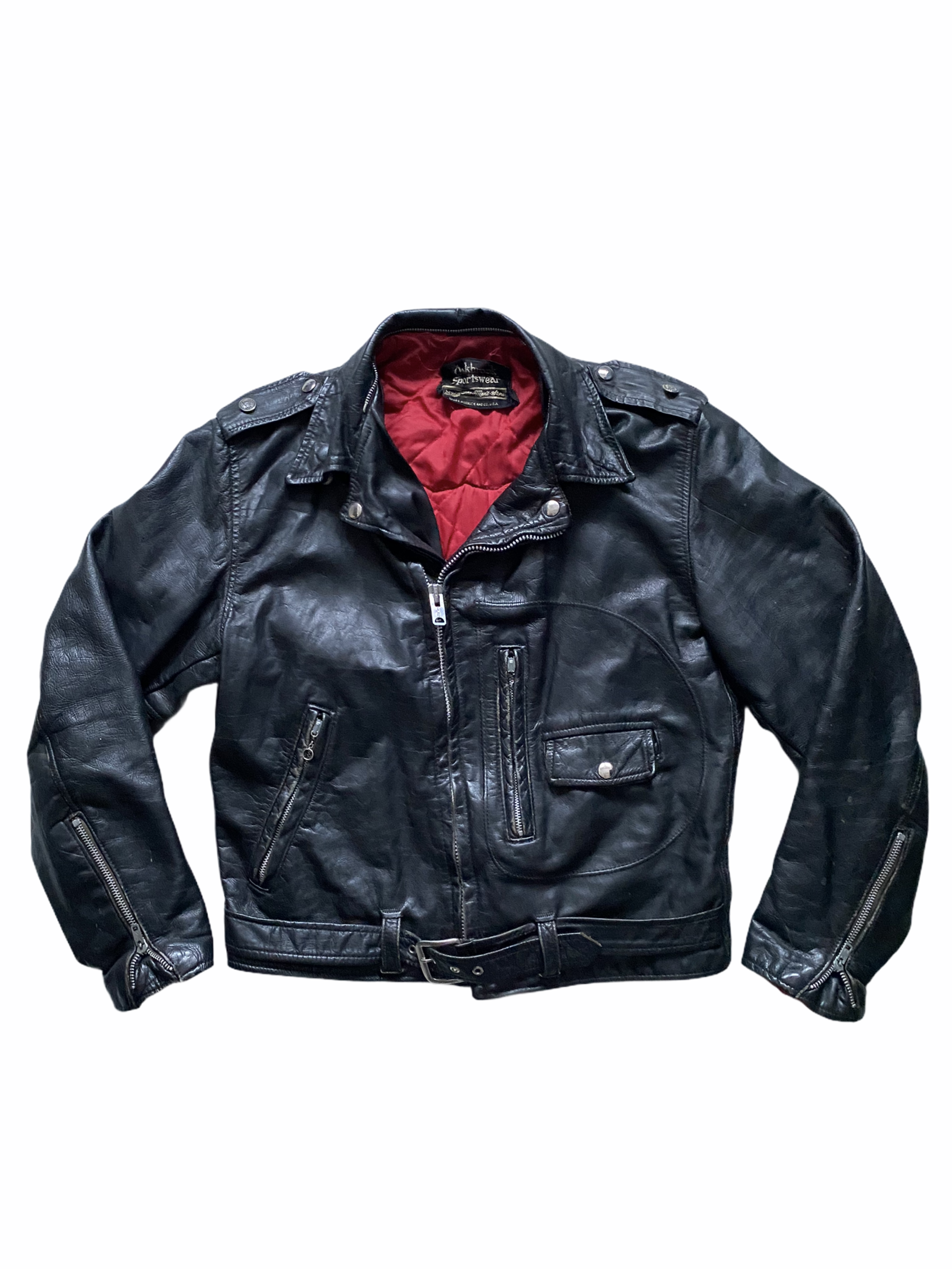 Black leather motorcycle jacket with silver zippers and red lining, displayed on a plain white background.