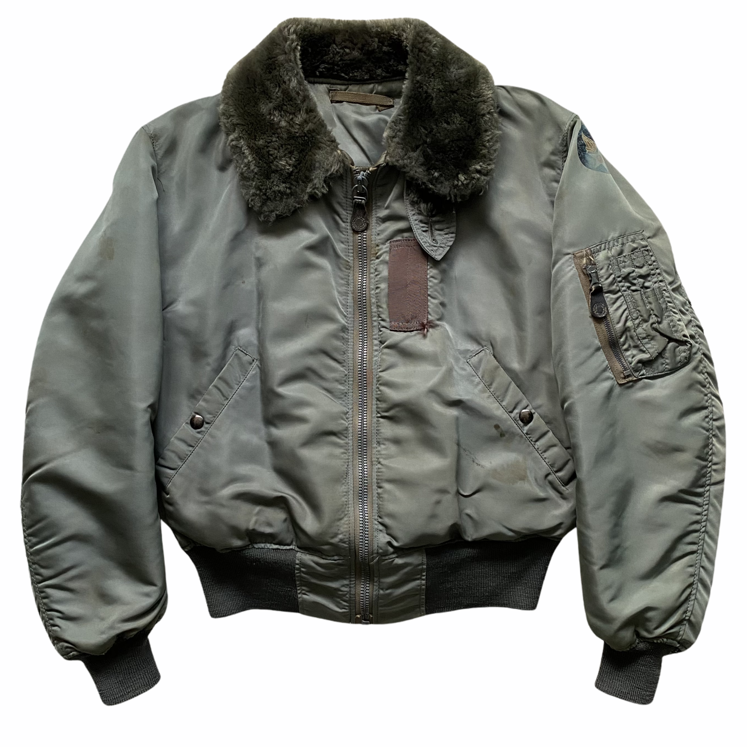 Military-style jacket with a thick fur collar, front zipper, and knit cuffs.