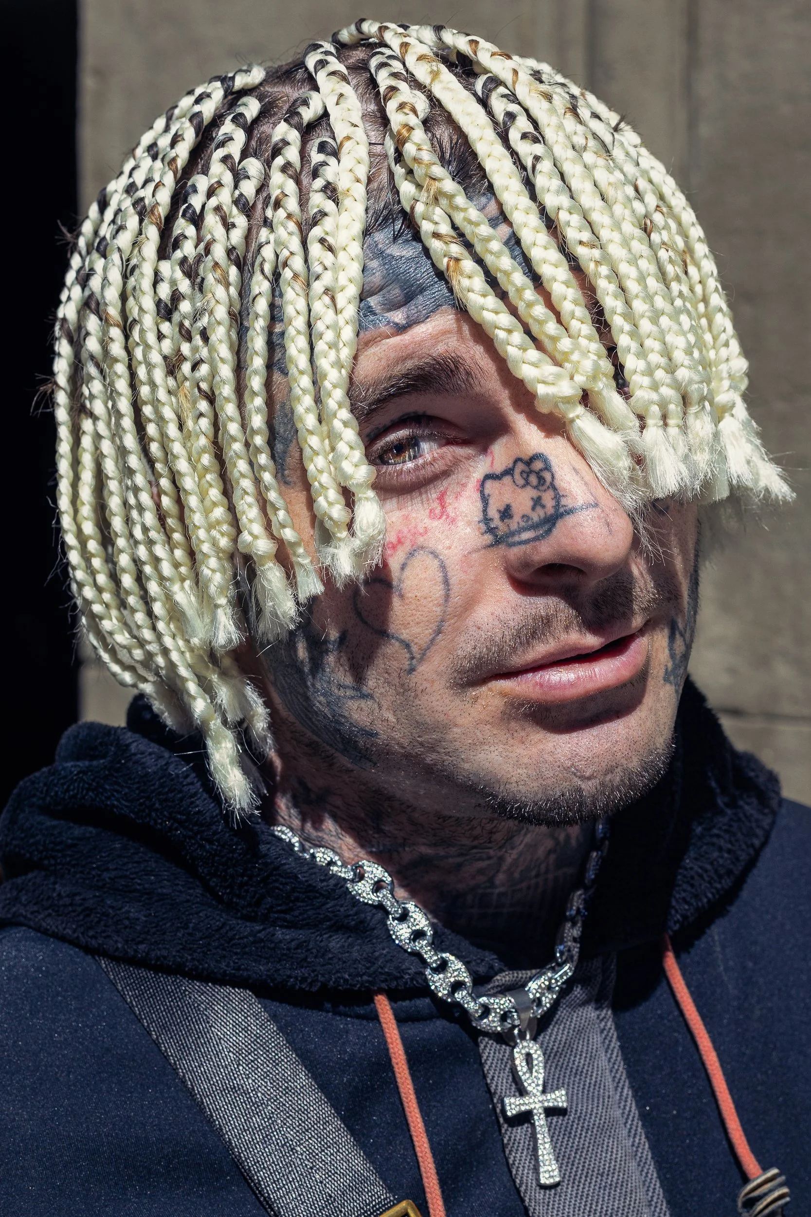 Every mark on that face was his decision, not his history.