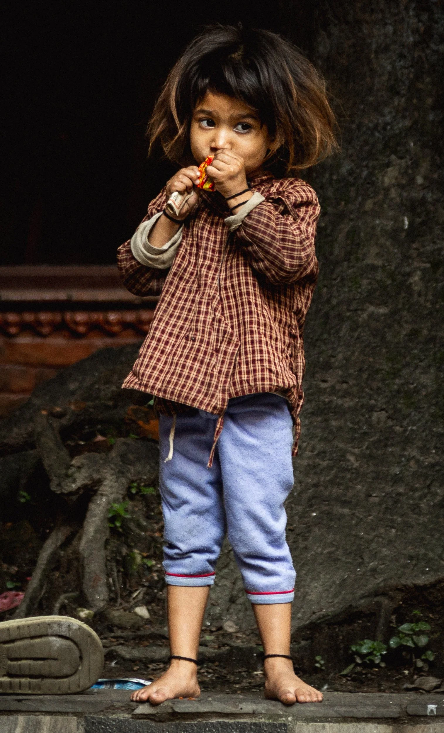 A stranger's coin, and thirty seconds that were entirely hers. Kathmandu, Nepal. 2025.