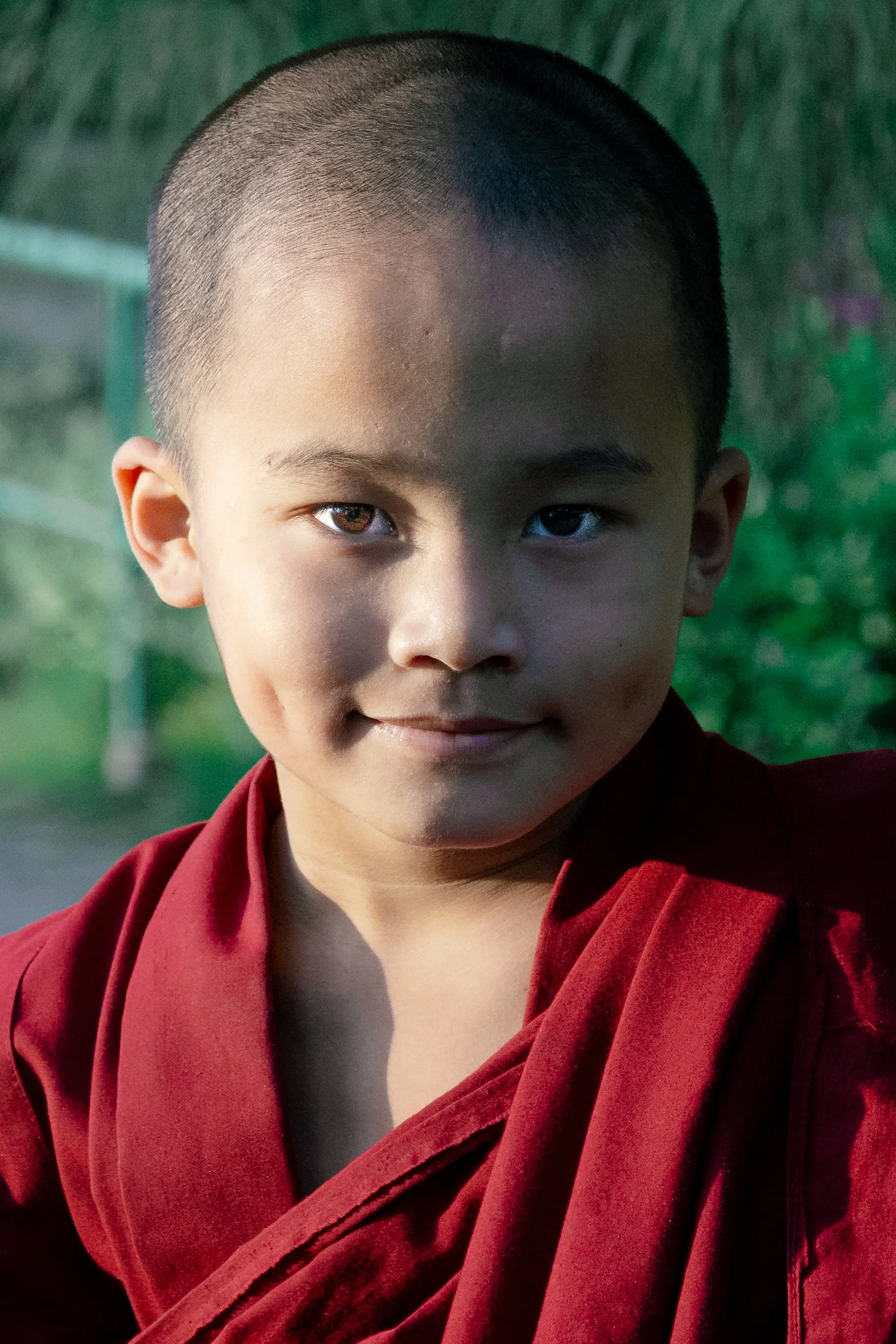 Half in shadow, half already smiling. — Kathmandu, Nepal. 2026
