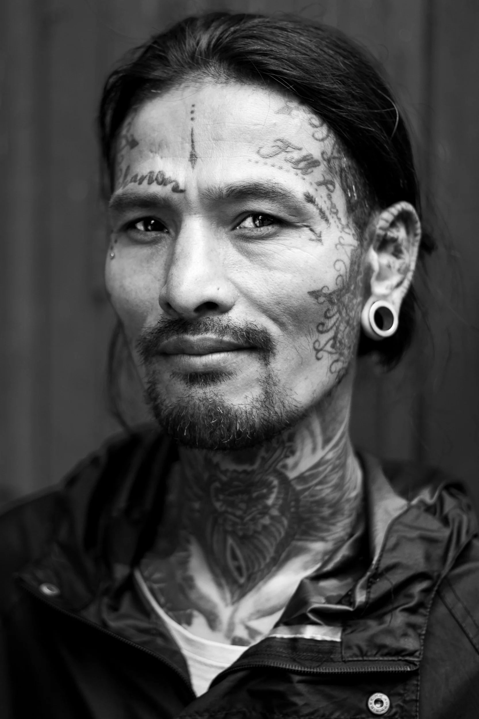 portrait of a tattoed man on the streets of kathmandu