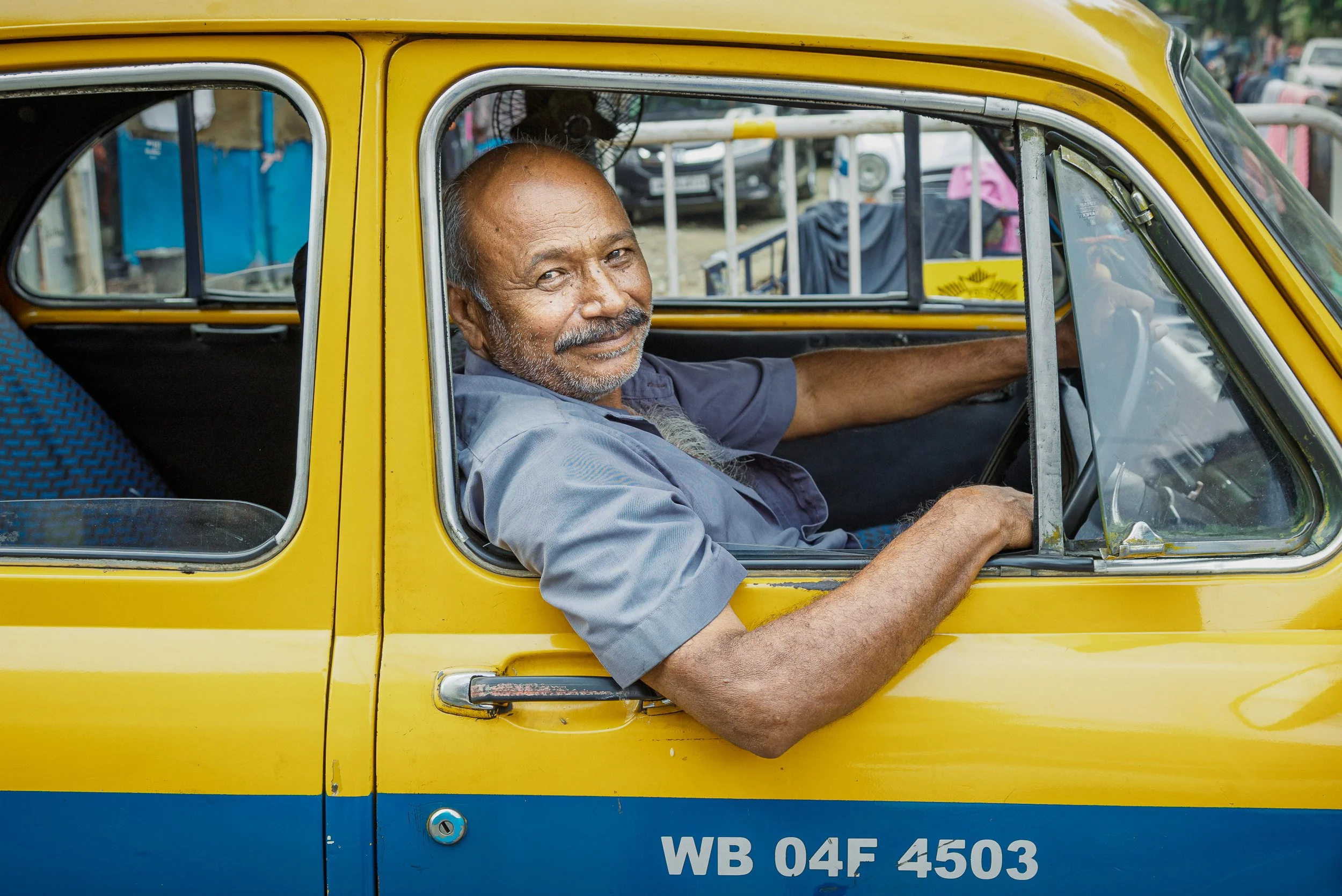 Kolkata, mid-conversation with someone off-frame. — Kolkata, India. 2025.
