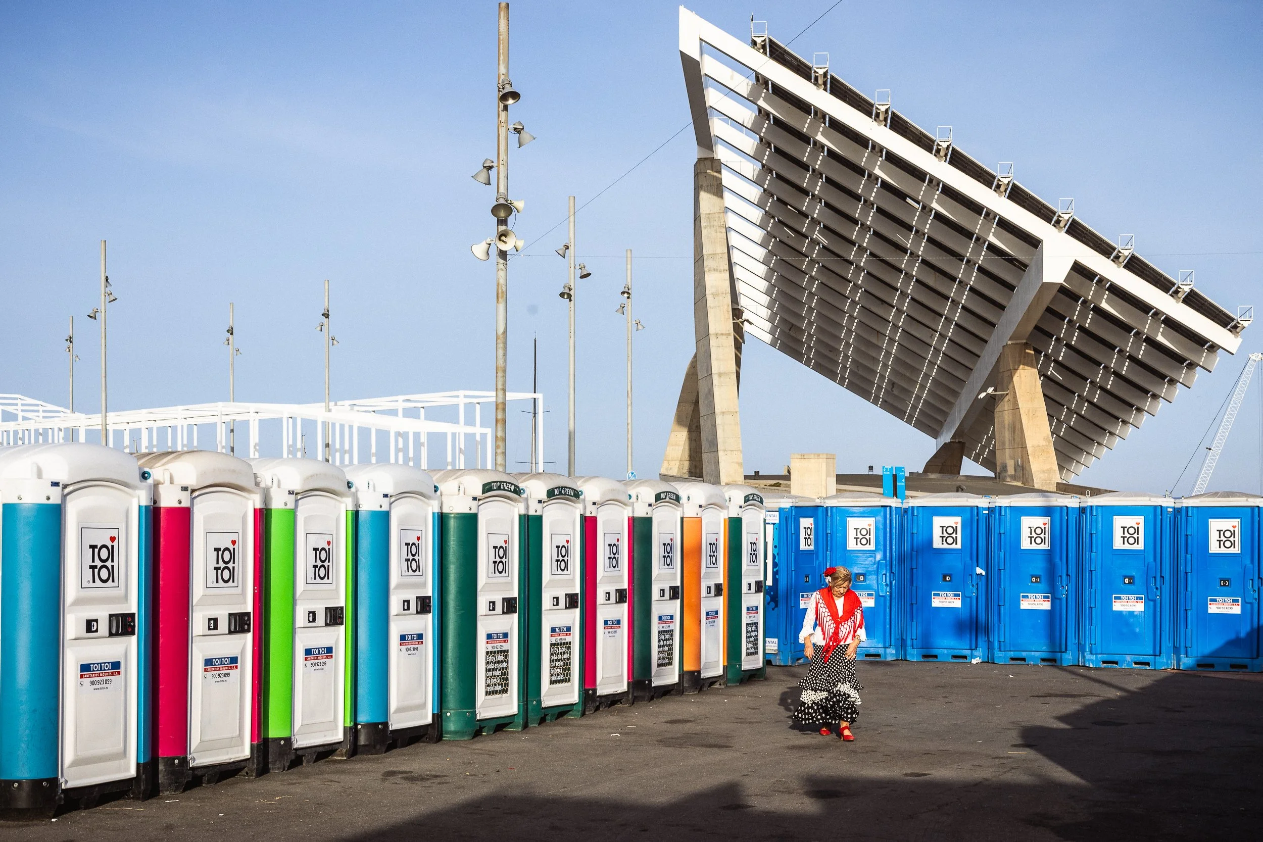 She didn't dress to match the toilets. She matched anyway. Barcelona, Spain. 2026.