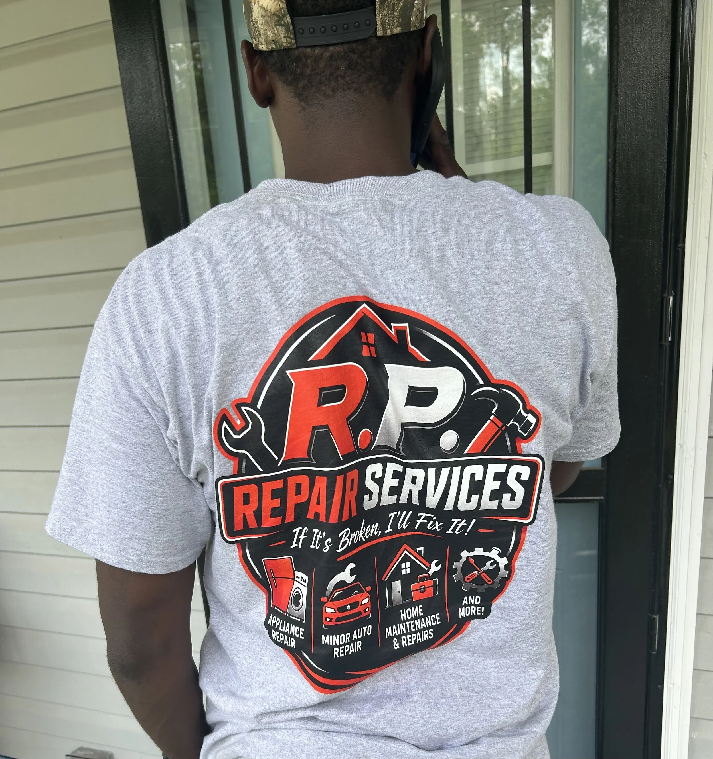 Randy P. Services owner wearing his company work shirt during a service call in Cairo, Georgia.
