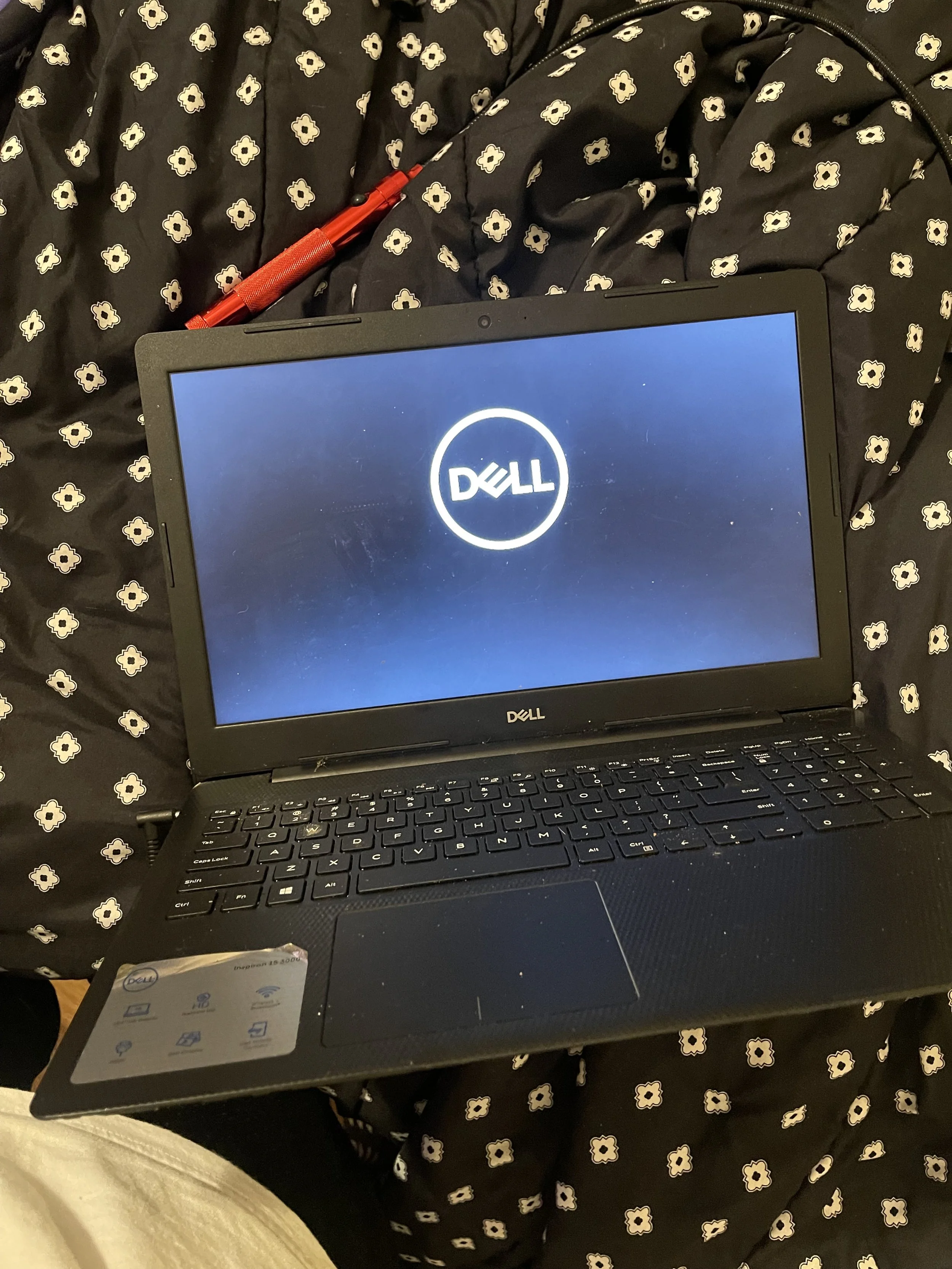 Inspected and serviced the internal hardware of a Dell laptop, then confirmed a successful startup after reassembly.