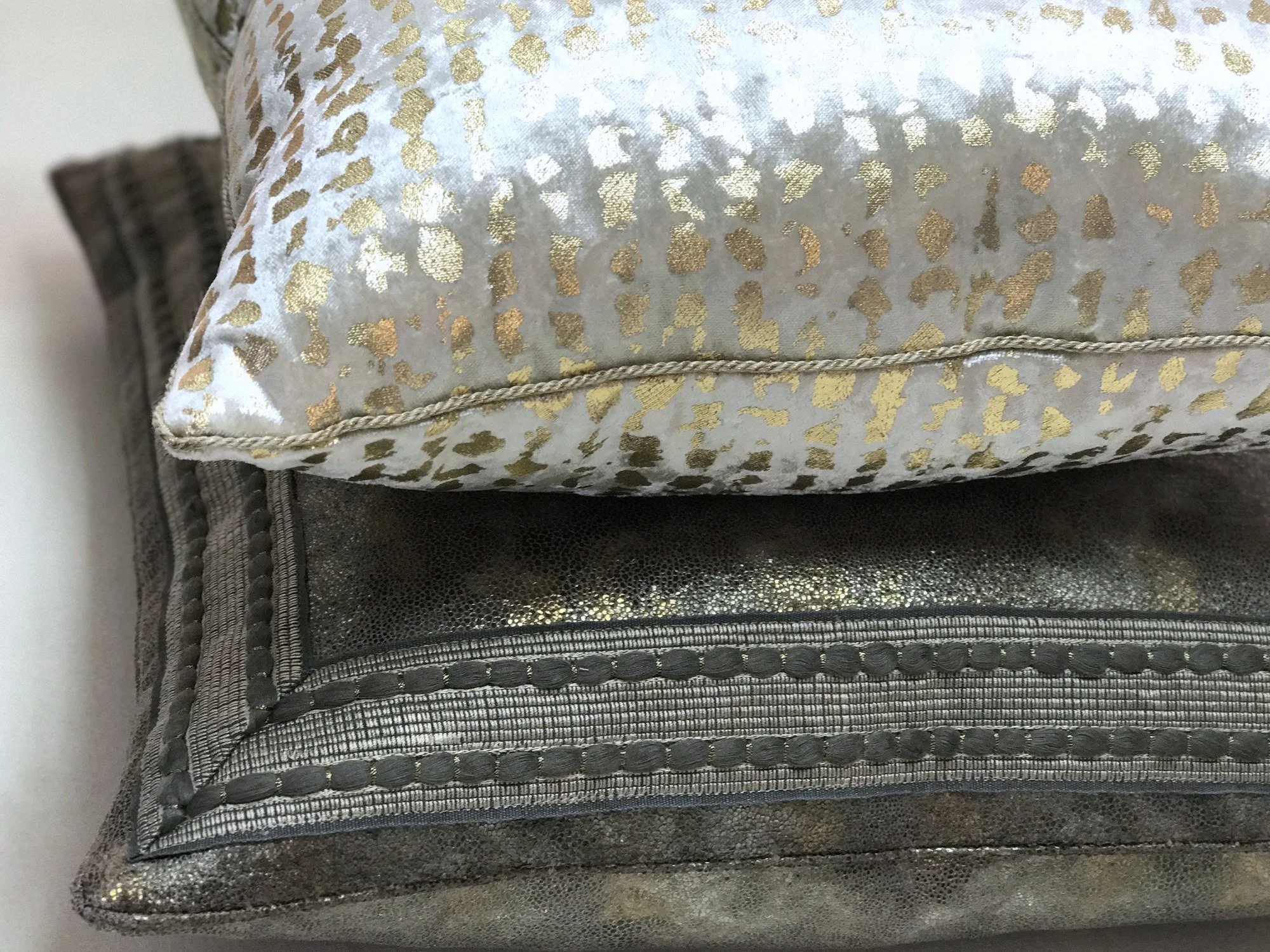 Faux metallic leather pillows with mitered trim • Design: Tara Dobrec Designs