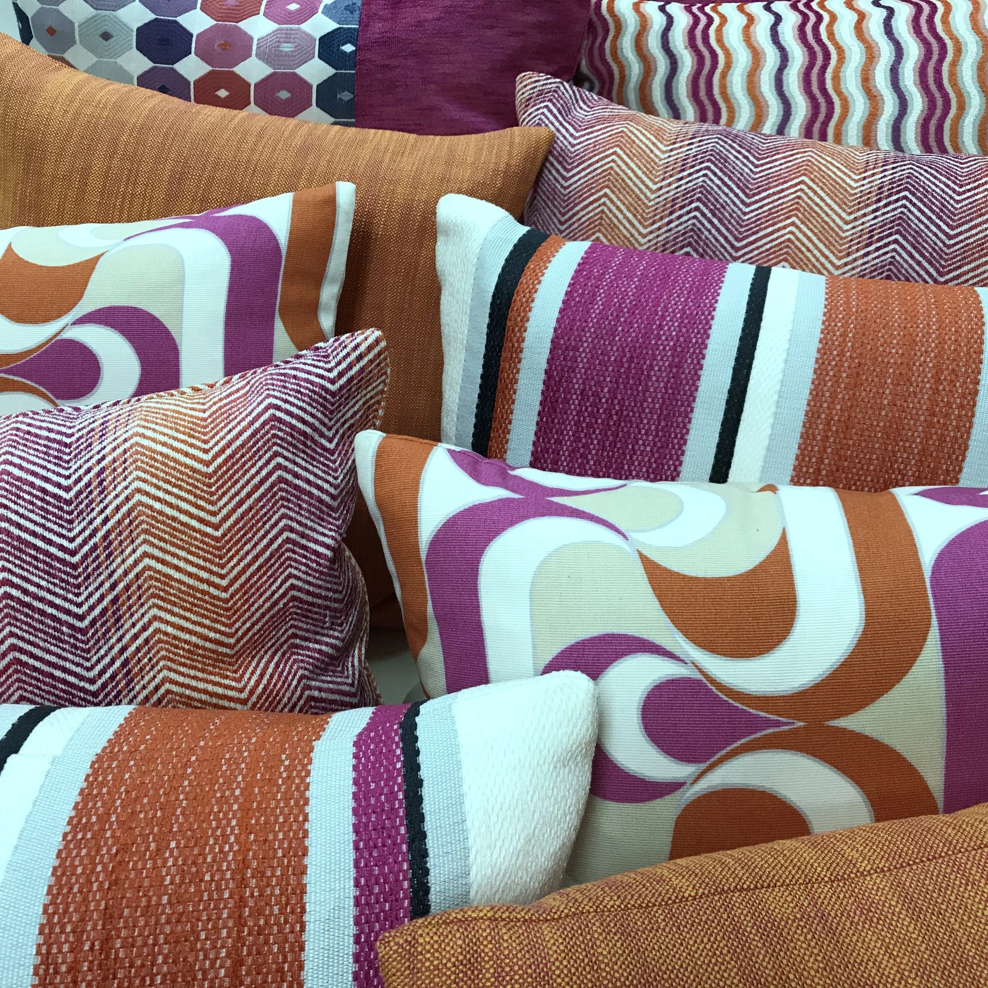 Collection of pink and orange pillows • Design: Tara Dobrec Designs