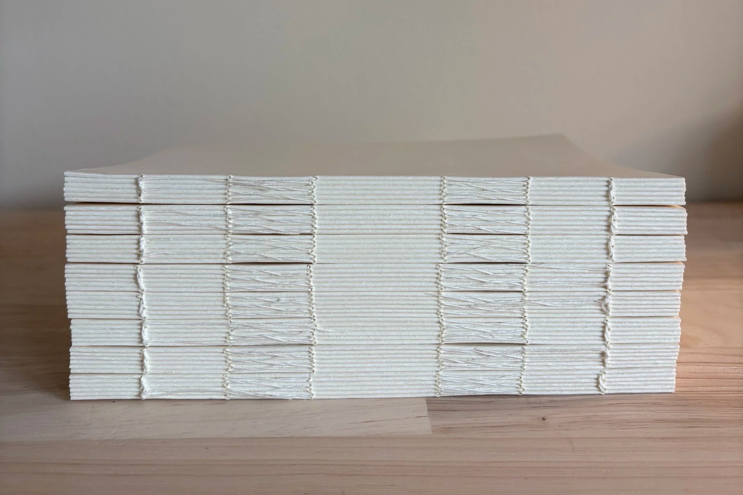Custom Bindery, hand sewn book spine, PVA glue, waxed thread