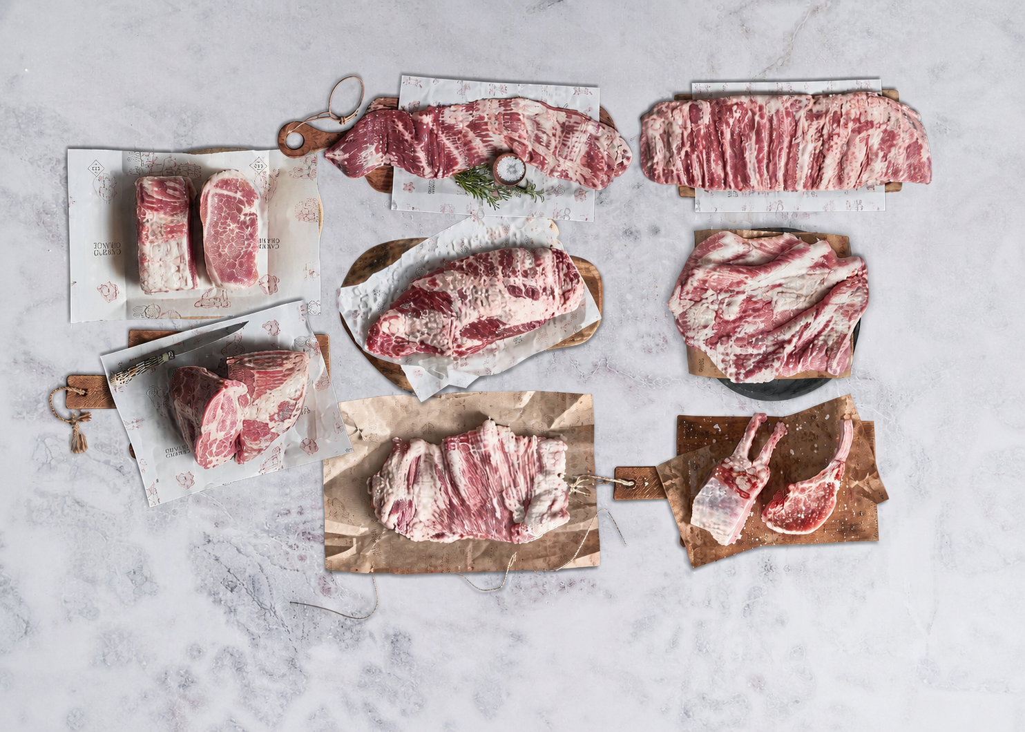 Campo Grande Ibérico pork cuts arranged as a full product lineup, with the rib rack positioned along the top.