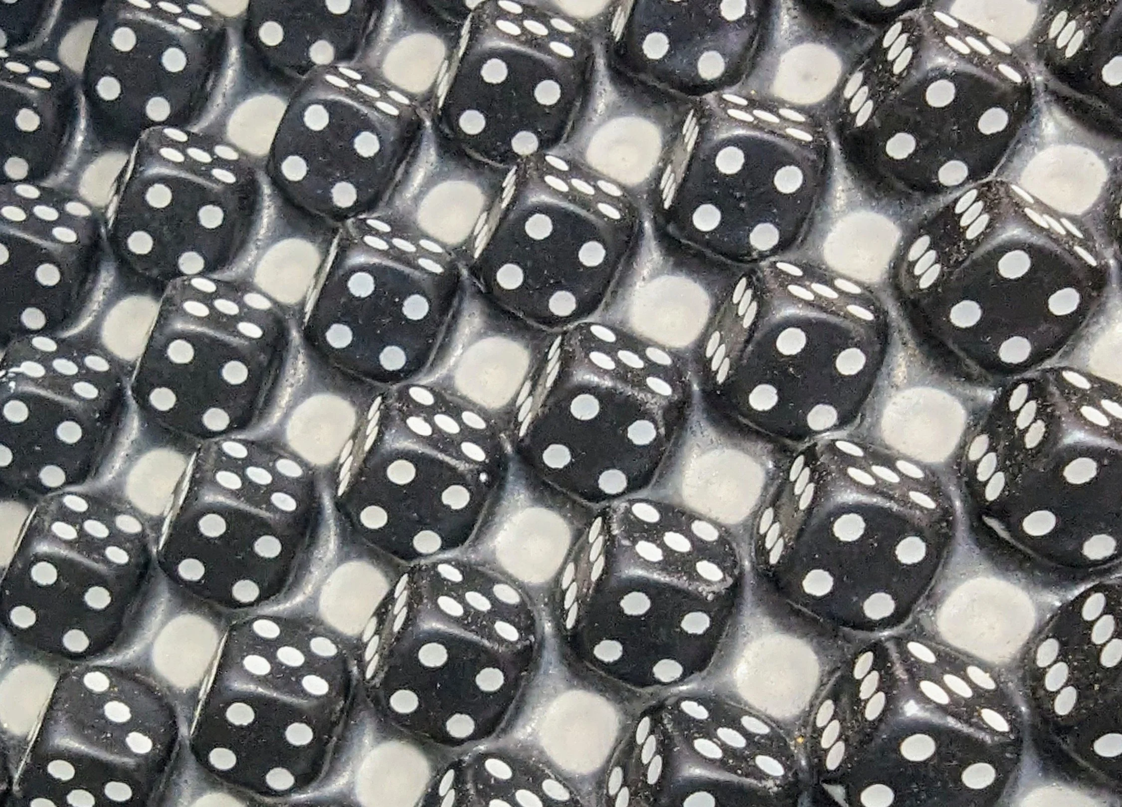 Three Nelson Mandela by Trig Art Close up of Dice against the assisting Pixel Dots