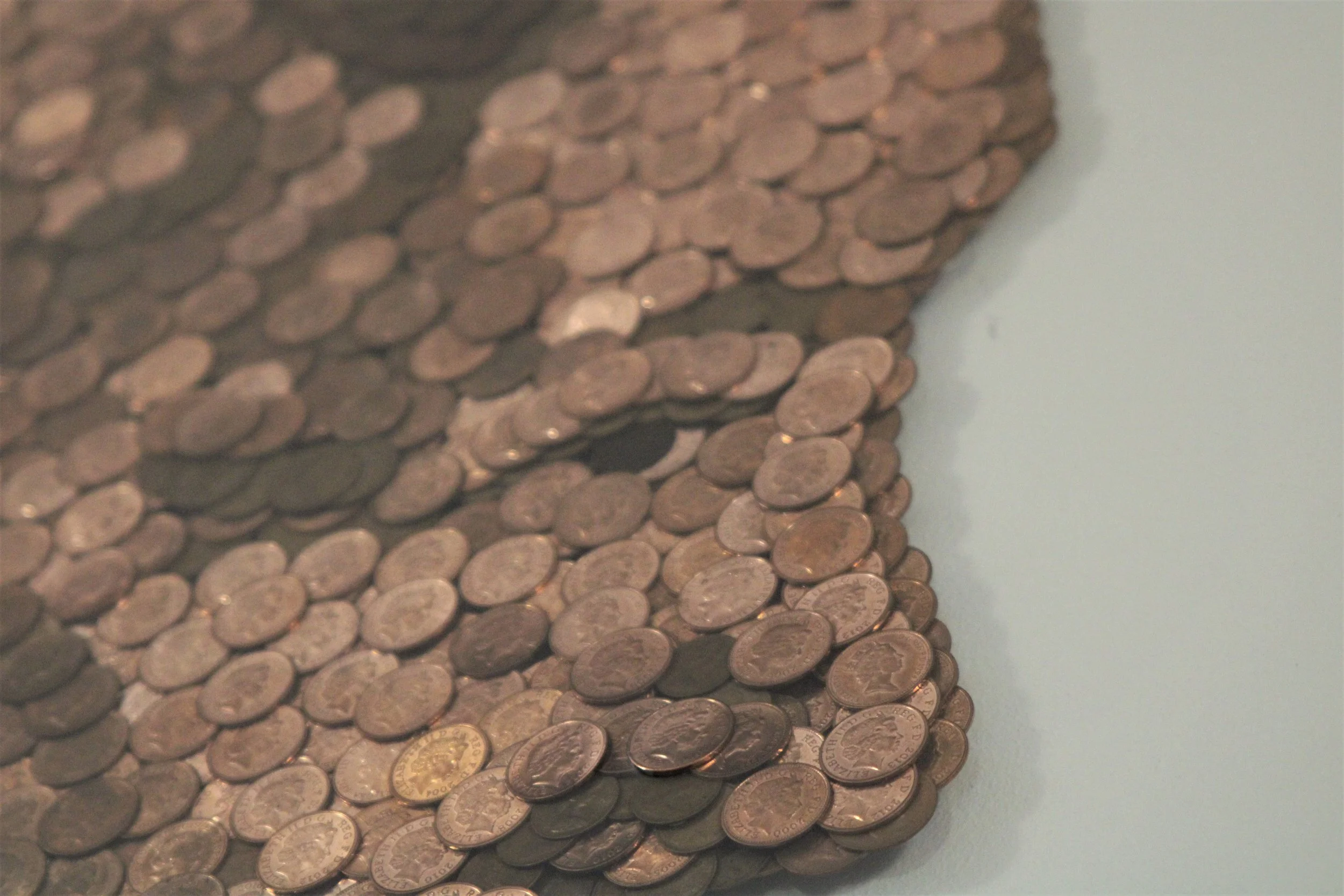 Detail of nose and eye  Made of Money, British penny mosaic of Queen Elizabeth II by Trig Art