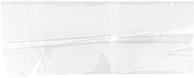 Empty transparent glass with a spoon on a white surface.
