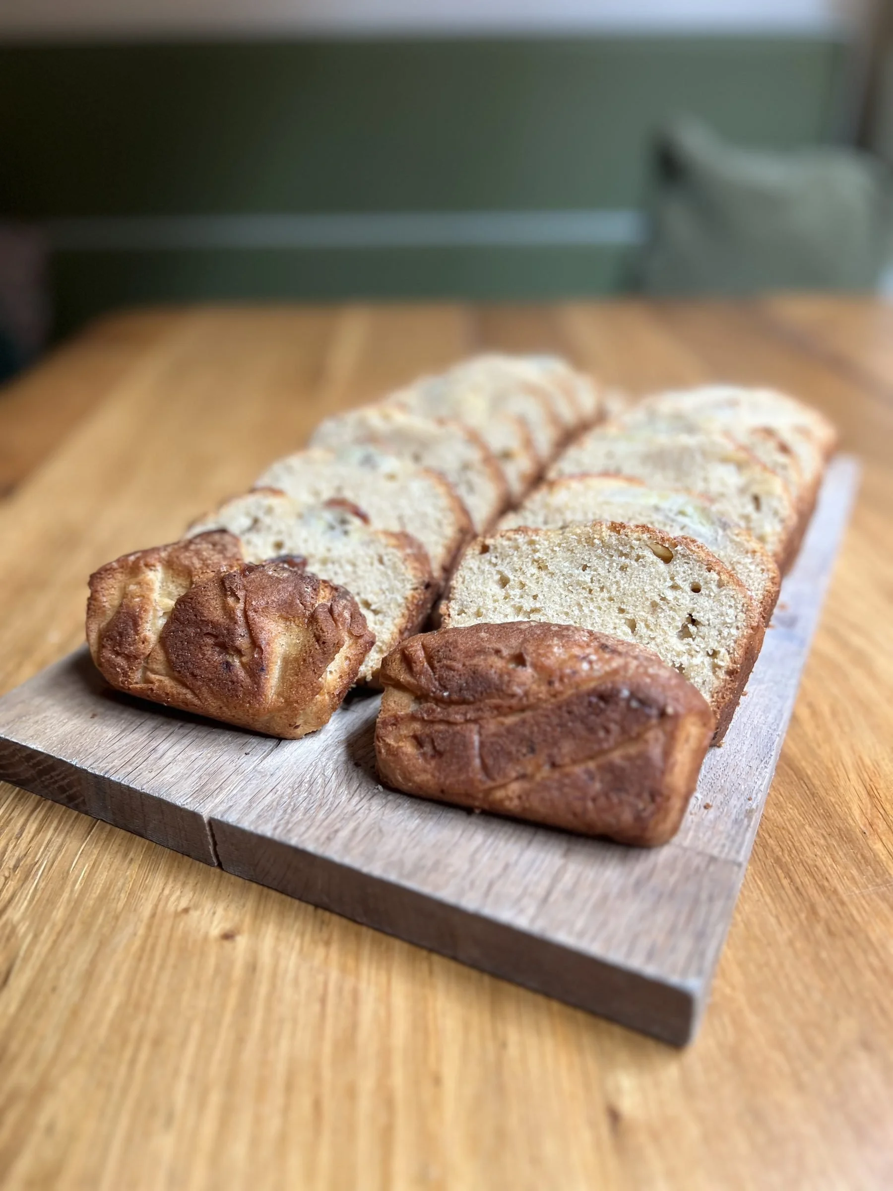 Sliced loaf of bread on a wooden cutting board.