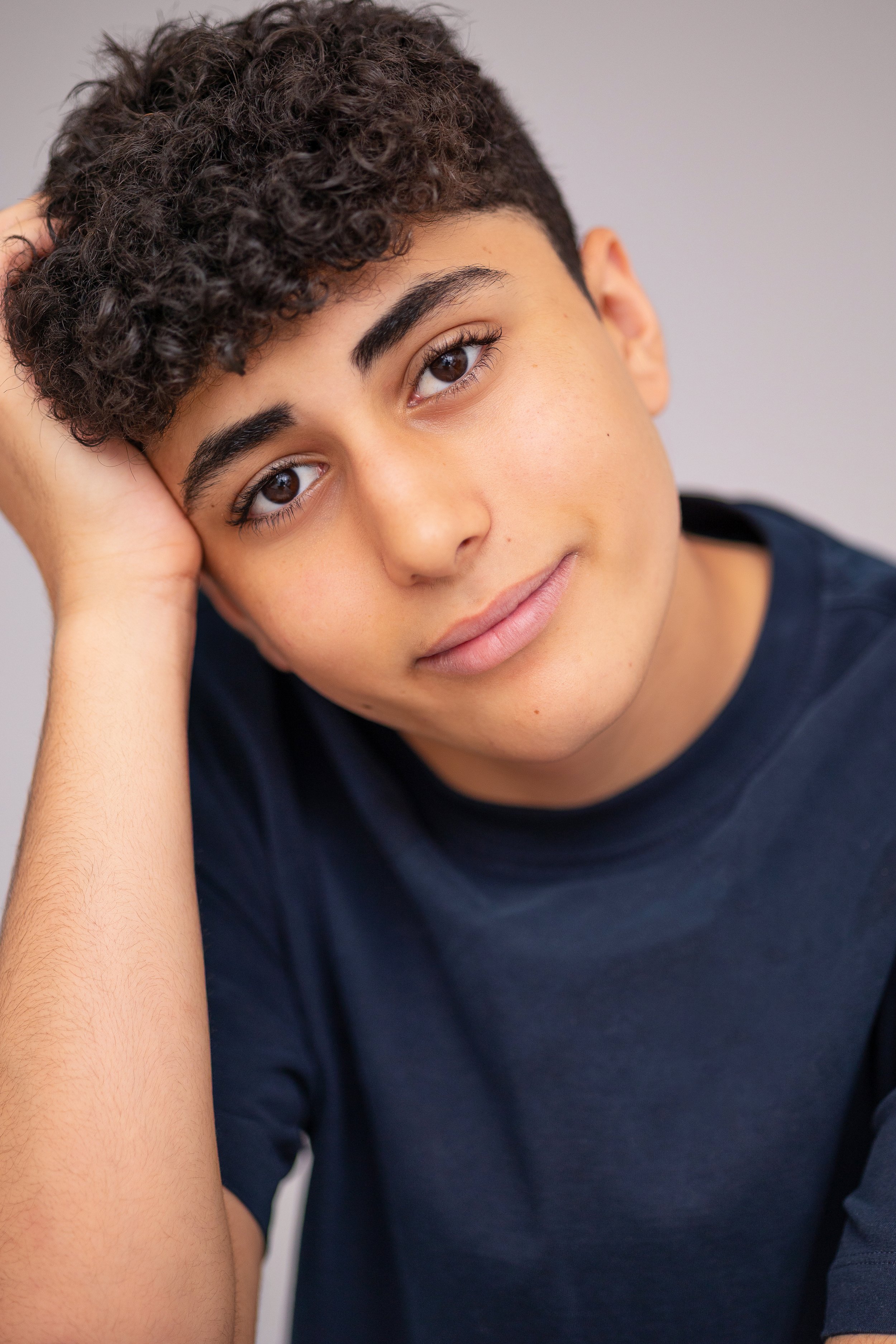 Close-up young actor headshot with a natural expression for a Spotlight and acting portfolio update.
