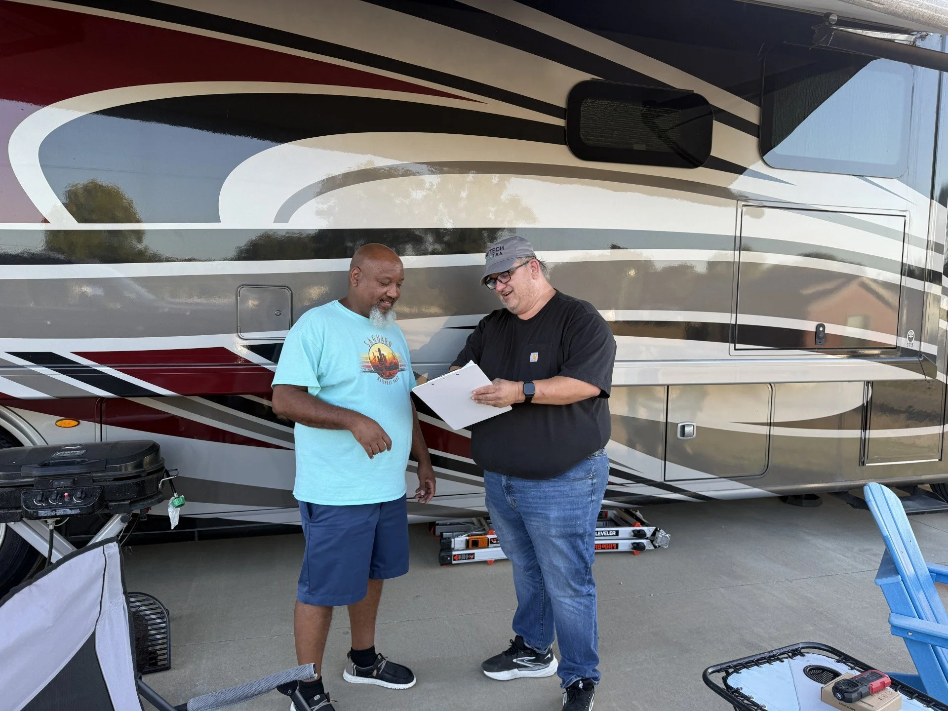 Happy customer discussing what work was completed on his RV.