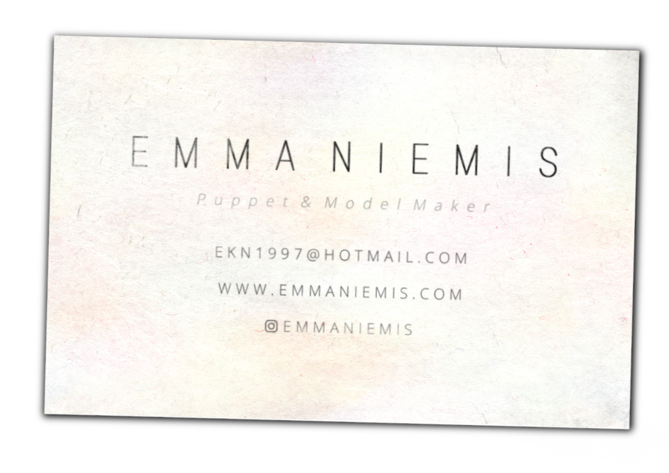 Business card for Emm aniemis, puppet and model maker, includes email, website, and Instagram handle.