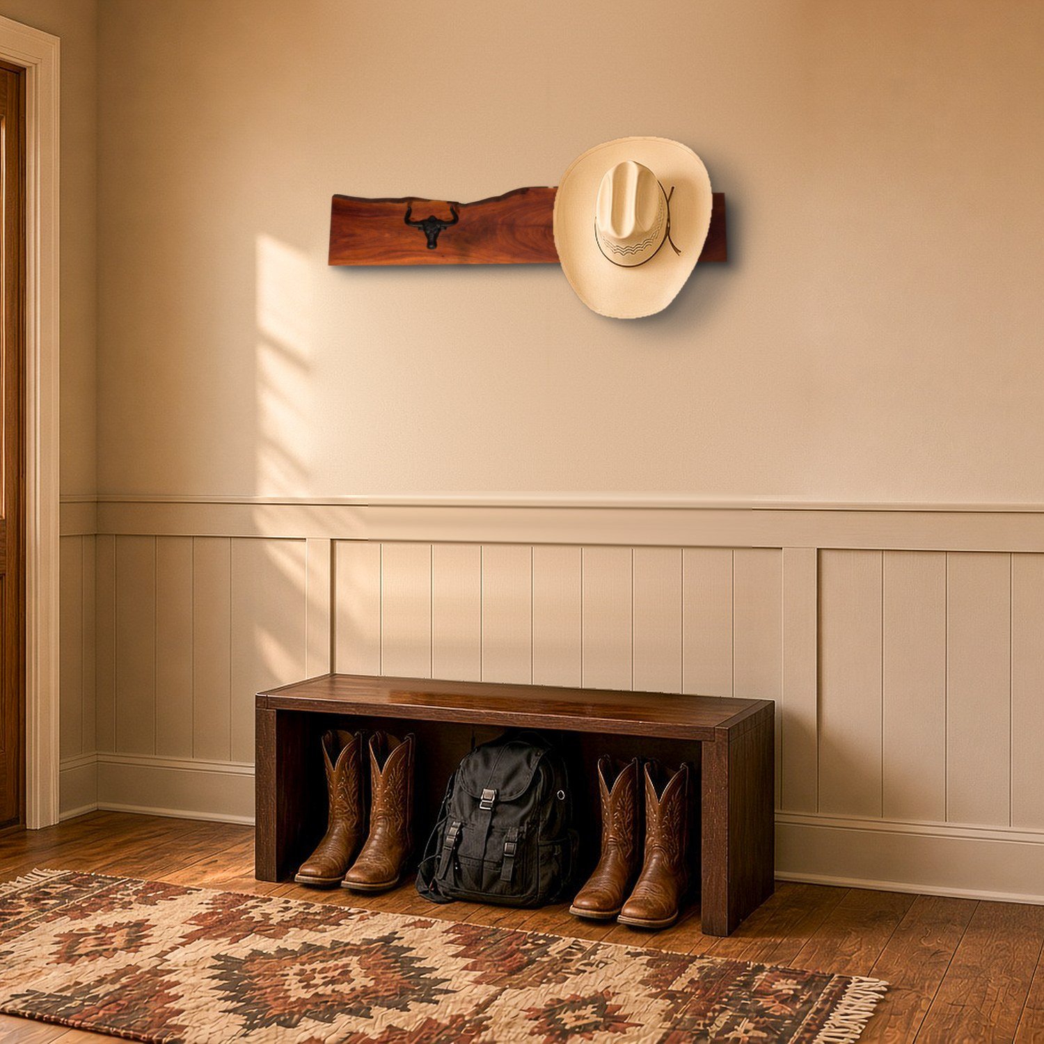 Mesquite hat rack holding a cowboy hat above an entryway bench with boots