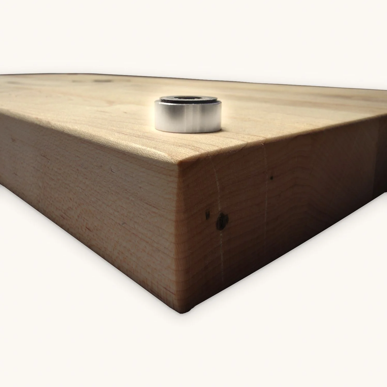 Elevated butcher block corner on a brushed nickel disc riser