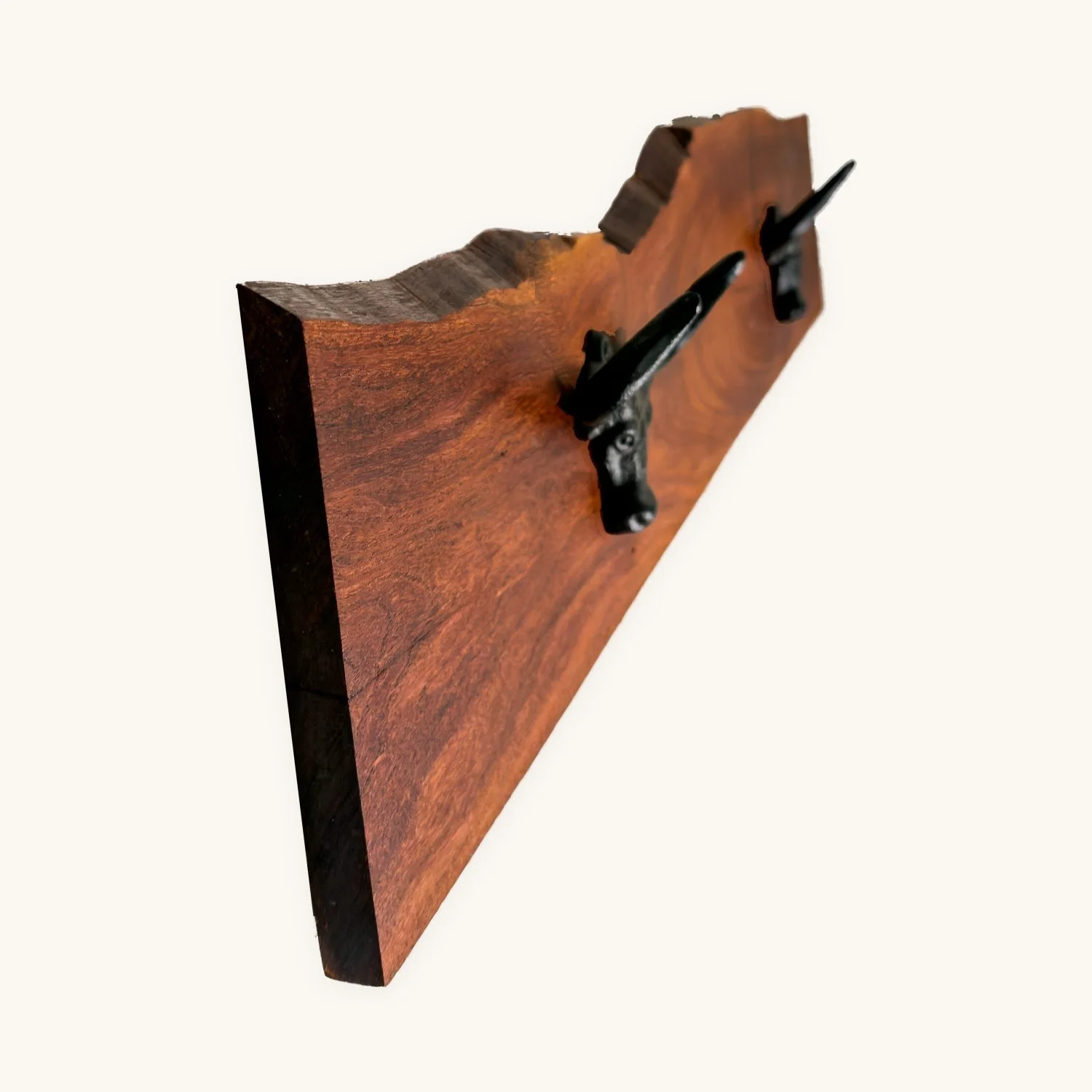 Live-edge mesquite hat rack with cast-iron longhorn hooks, side angle
