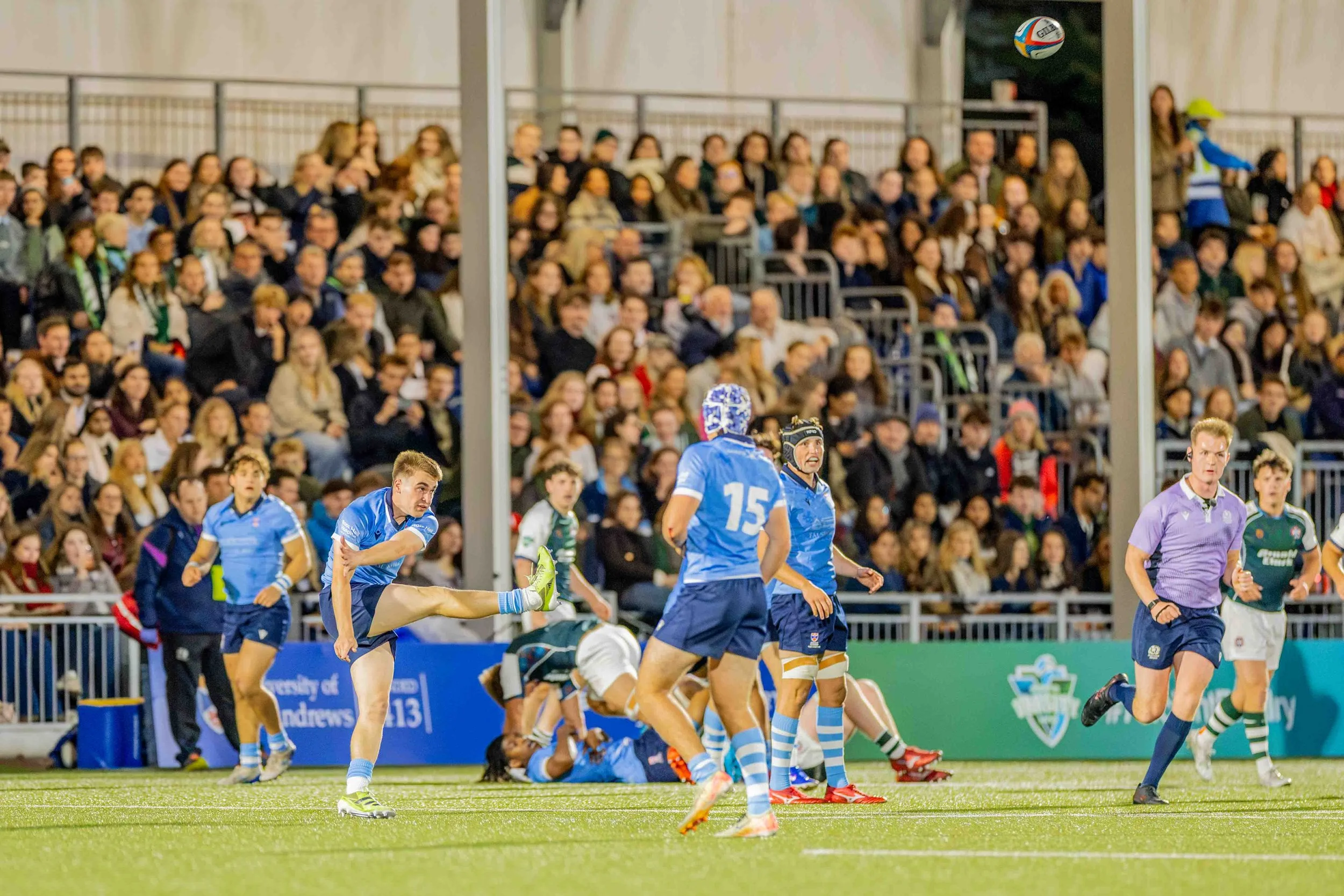 Rugby player kicking the ball at the Hive, Edinburgh