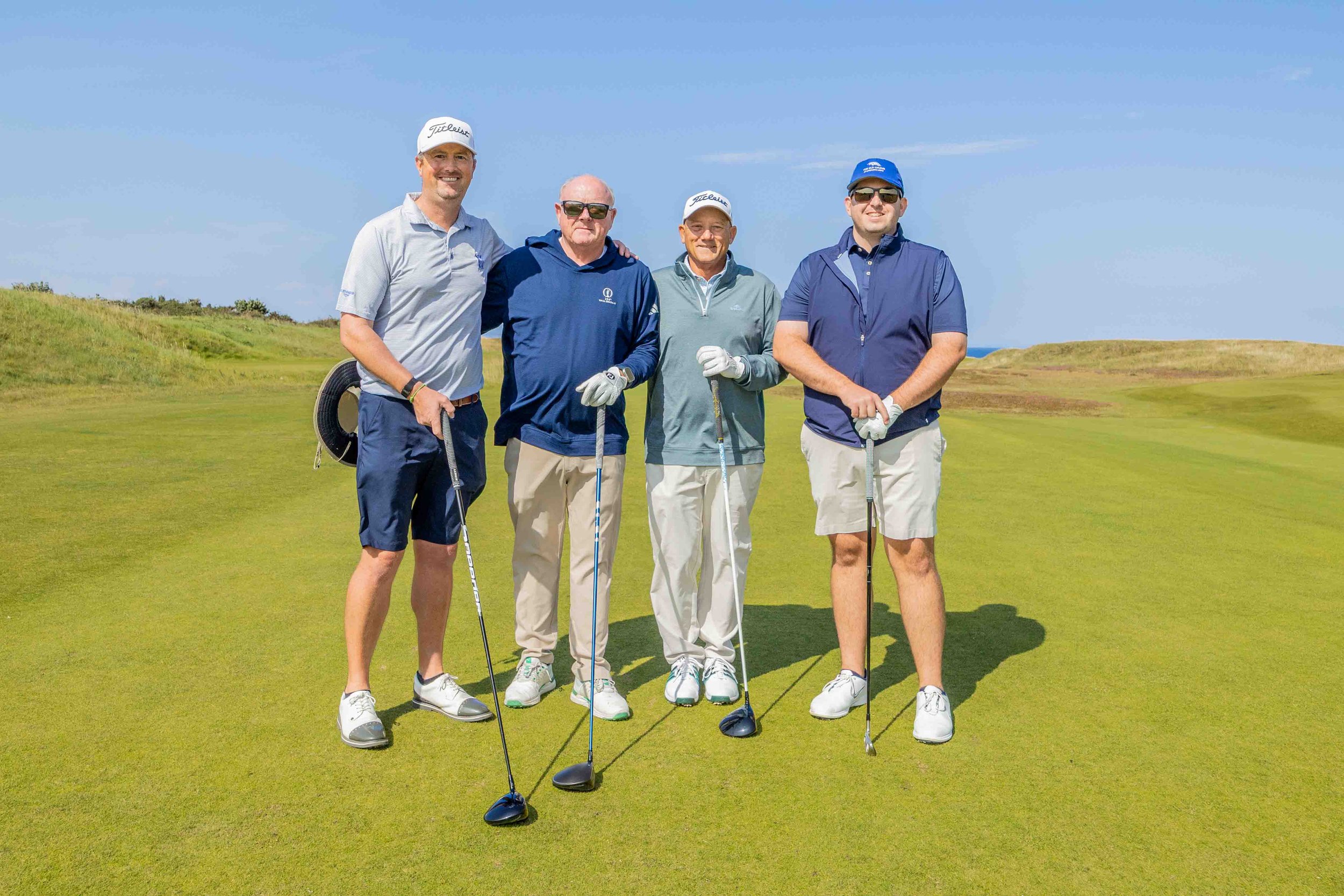 Group of 4 golfers on the Kingsbarns Golf Links 1st tee