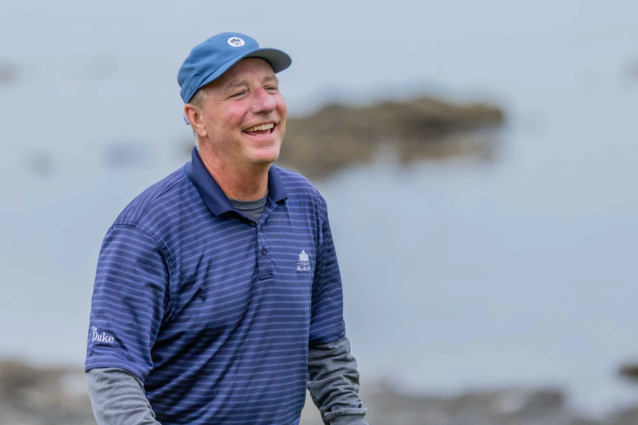 Golf player laughing whilst playing Trump Turnberry