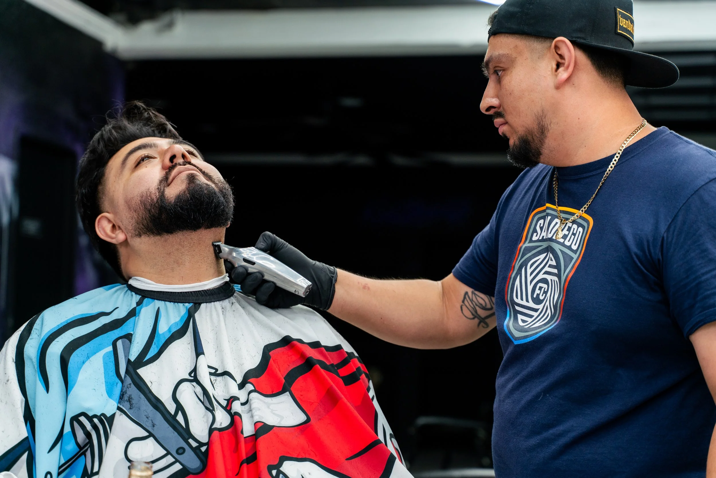 North Park Barbershop - Vandal Visions cutting hair