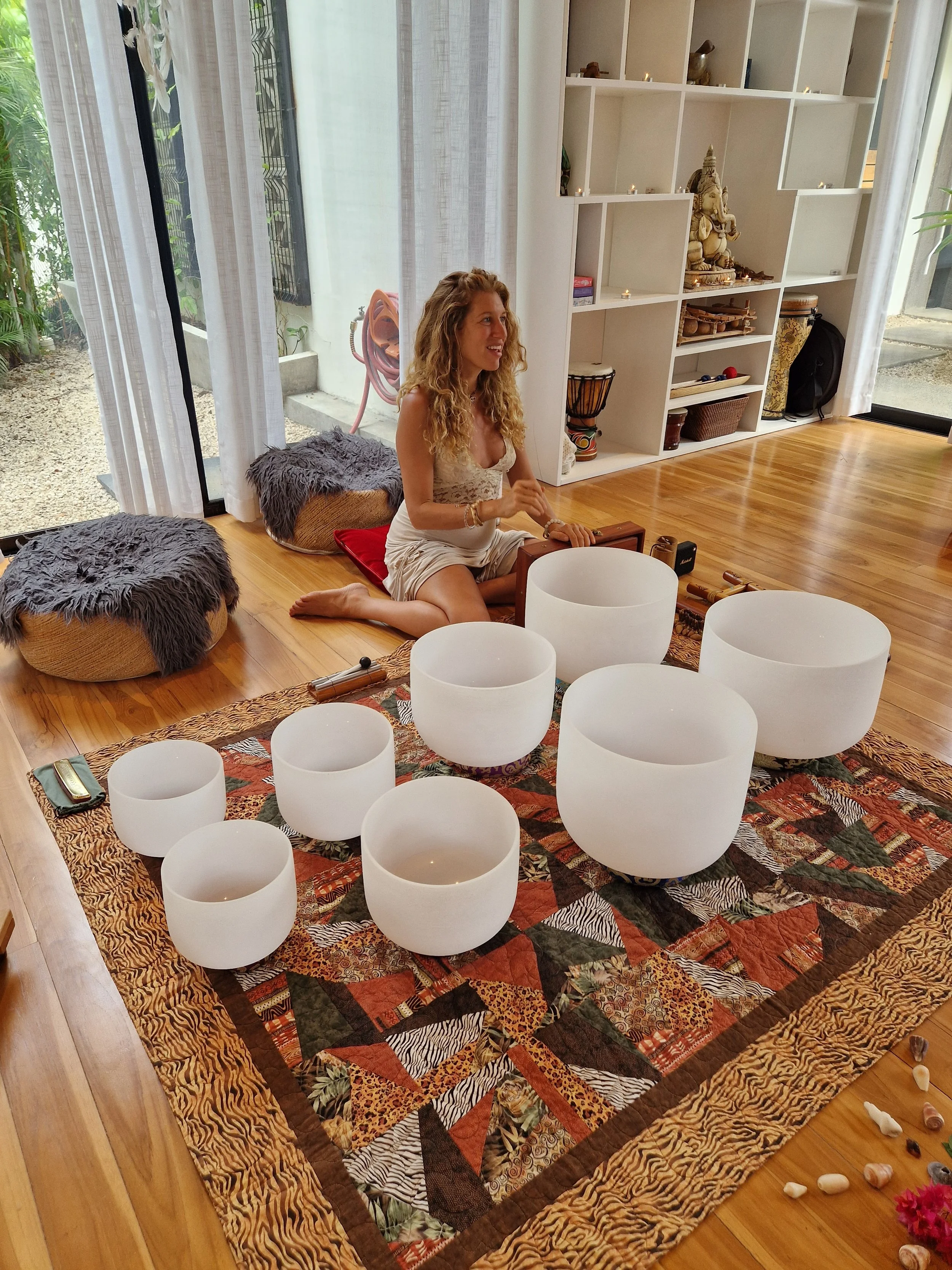 Fern Olivia leading a sound healing session with crystal singing bowls at a Costa Rica retreat