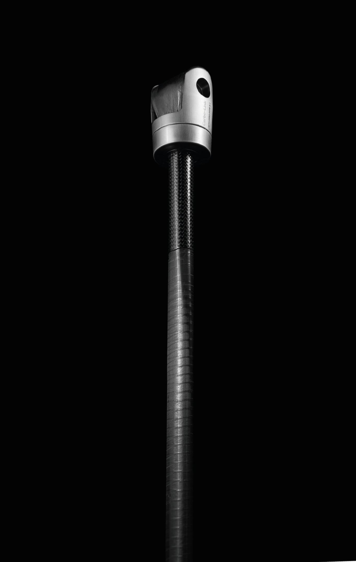 Close-up of a streetlight or lamp post against a black background.