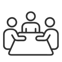 Three people sitting around a table in a meeting or discussion