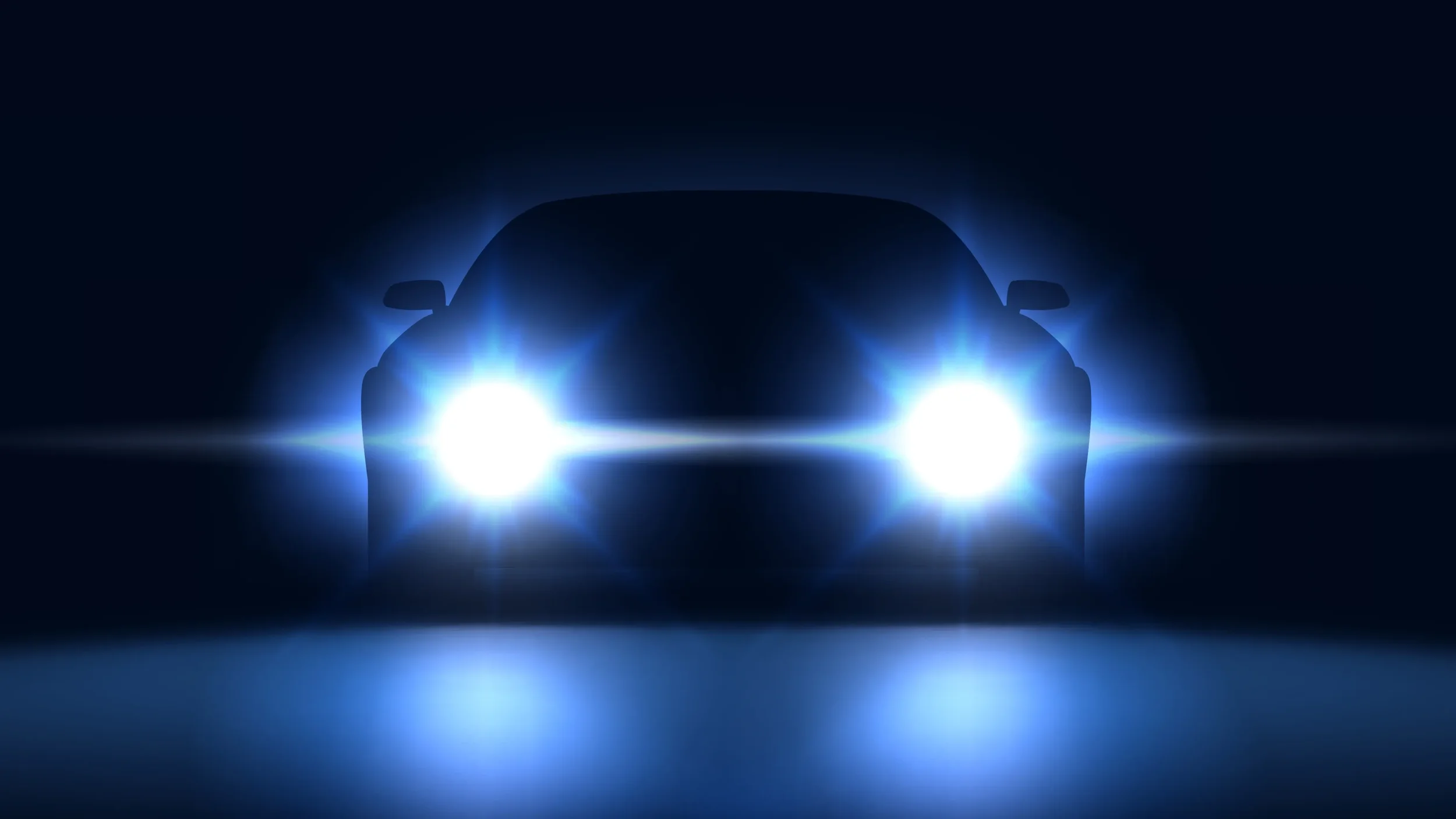 A car with bright headlights on in a dark setting, creating a glowing effect around the vehicle.