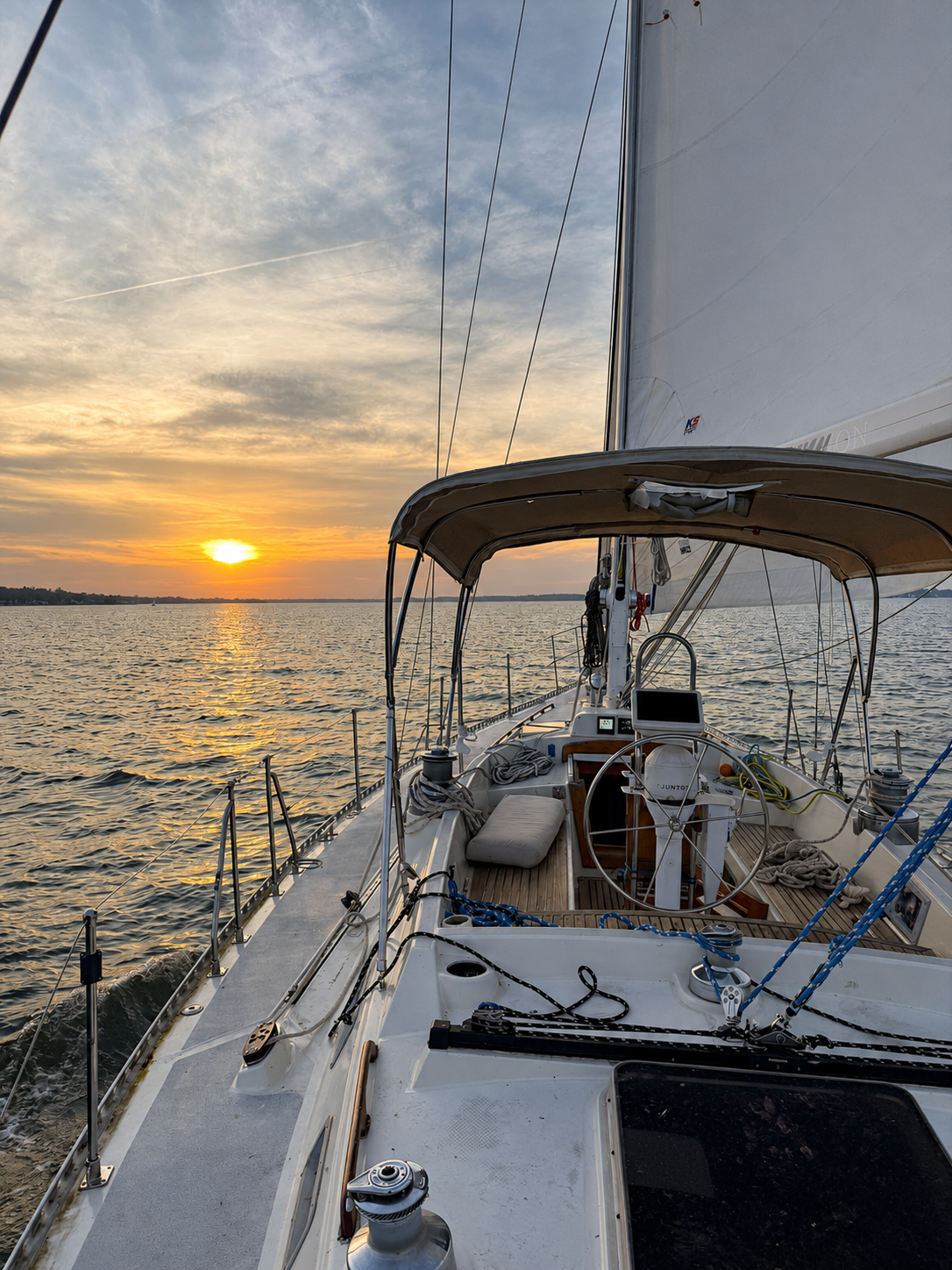 Kadima Sails sailboat deck and helm during a Chesapeake Bay sunset sailing experience.