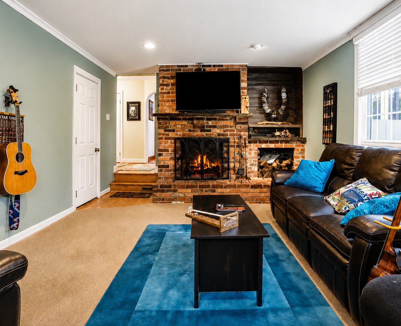 Cozy living room with brick fireplace and Smart TV at Bayberry Retreat in Arnold, Maryland.