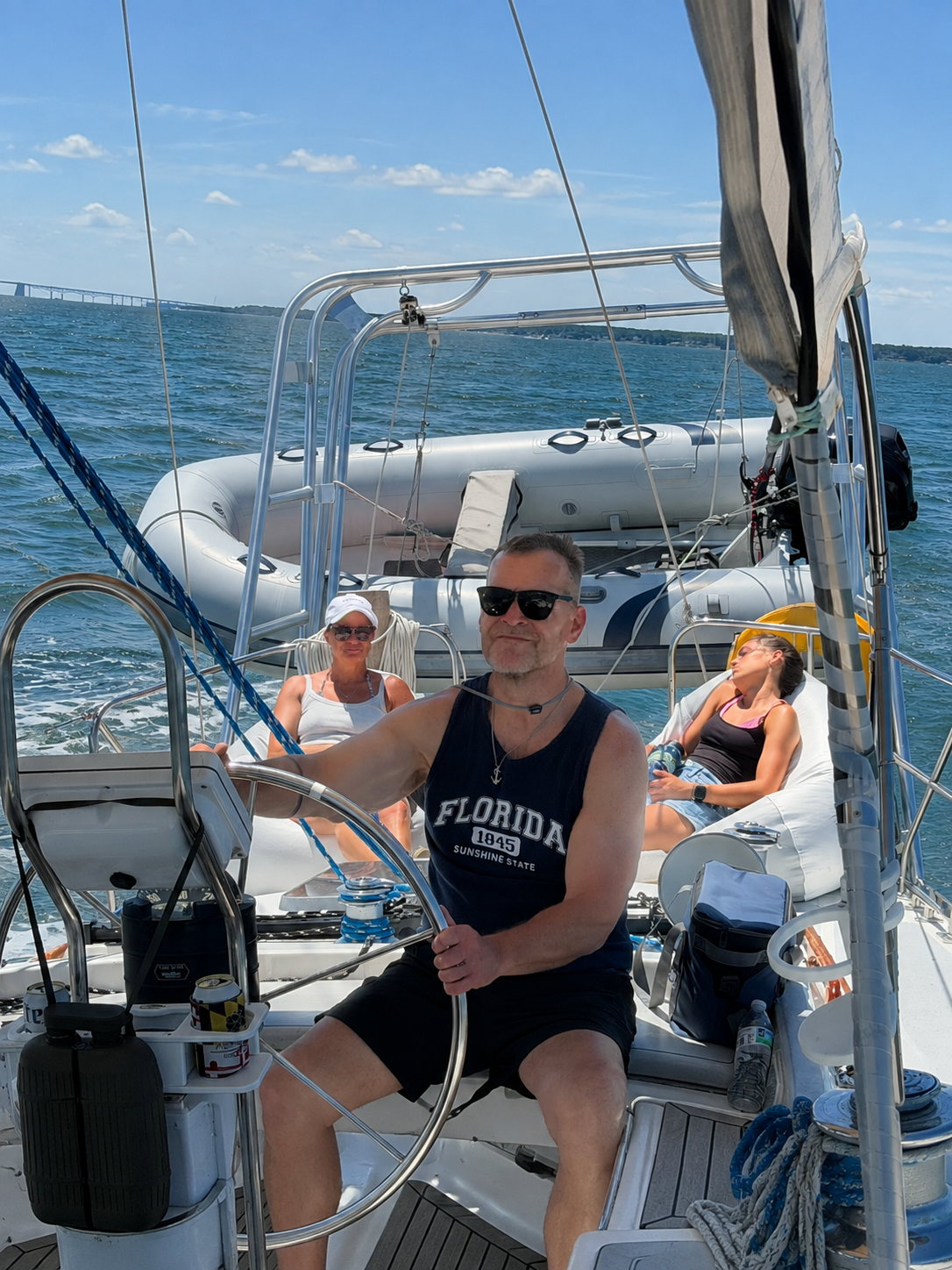 Kadima Sails guests relaxing together aboard a sailboat on the Chesapeake Bay.