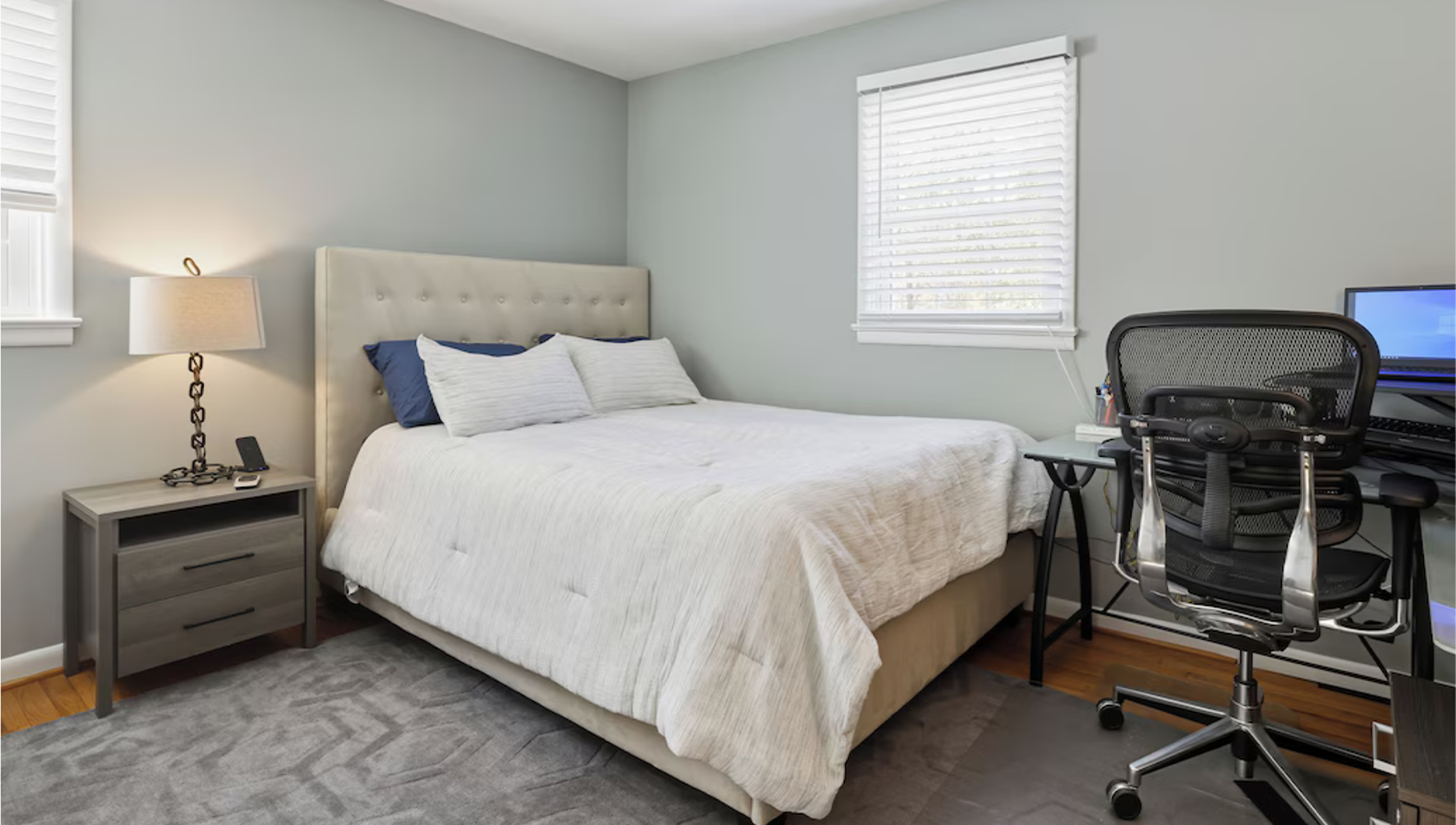 Bayberry Retreat bedroom with a dedicated workspace, desk, and comfortable sleeping area.