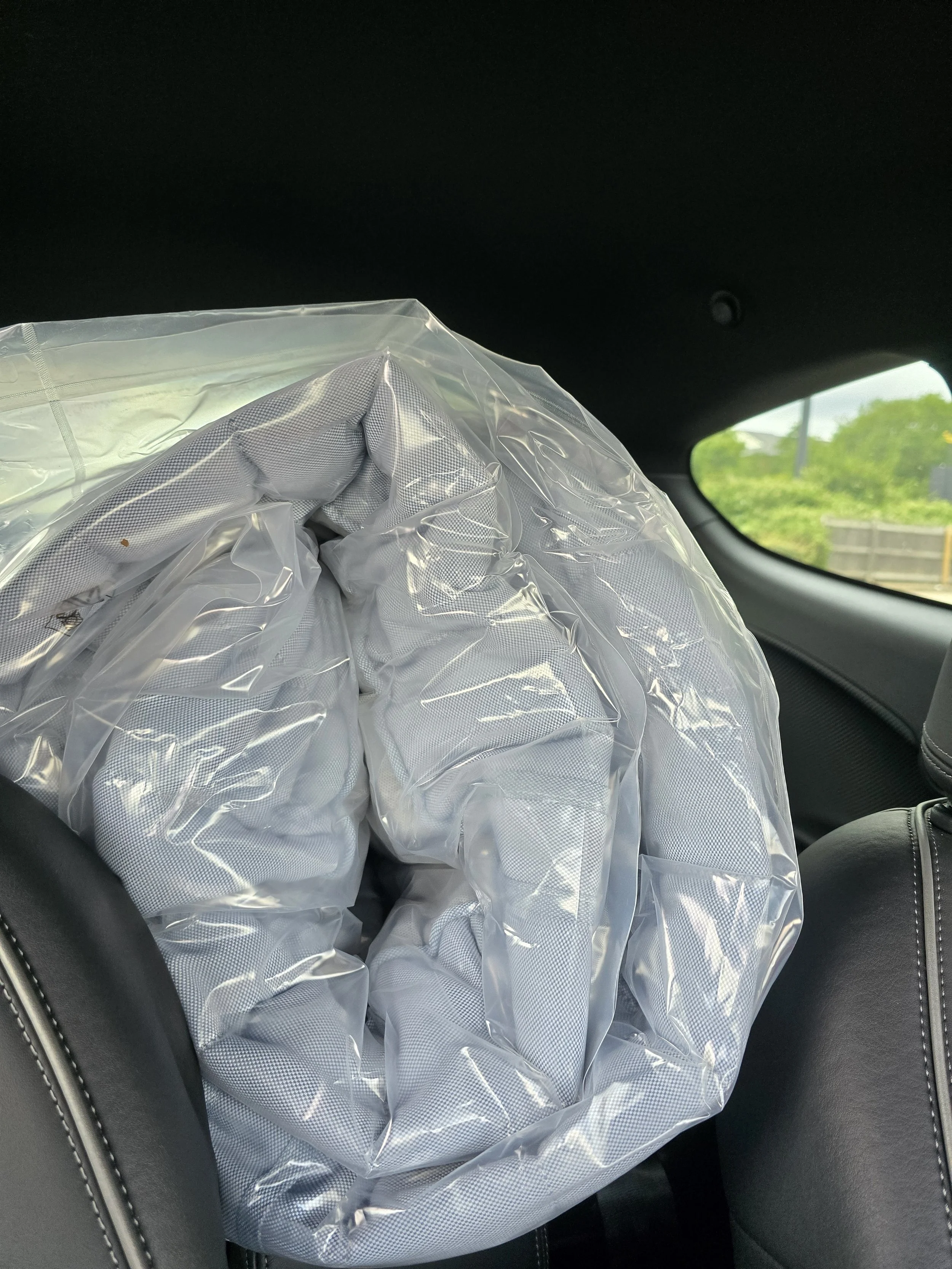 Alfa Romeo Mito interior containing a double mattress to demonstrate the cargo capacity.