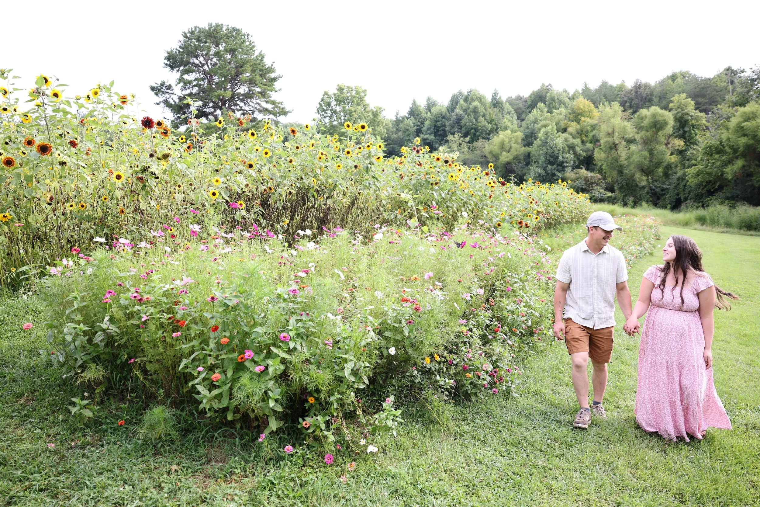 Guests walking through the flower garden at Twin Willows.