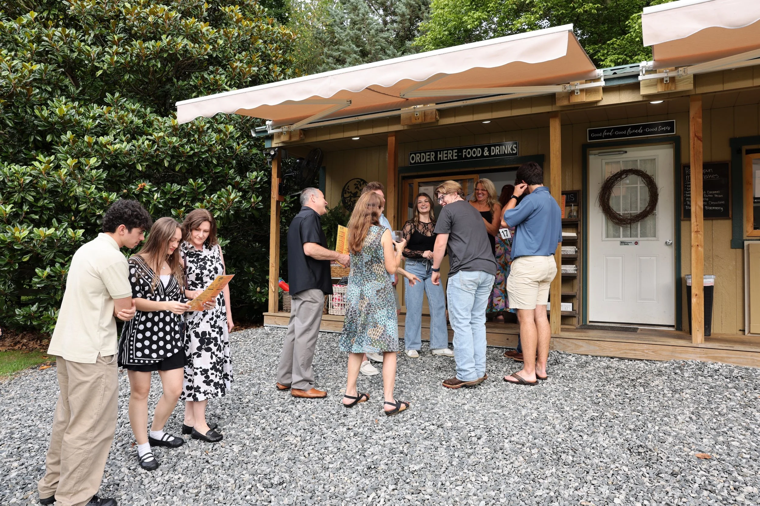 Guests ordering food and drinks at the Cabin at Twin Willows.