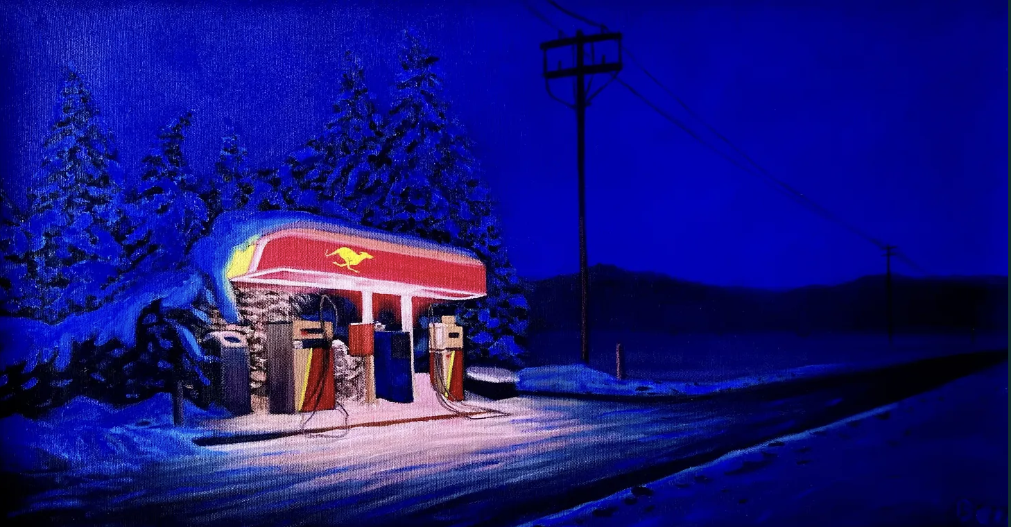 Snow-covered landscape at night with a lit gas station featuring a red canopy with a yellow bird logo, surrounded by snow and power lines.